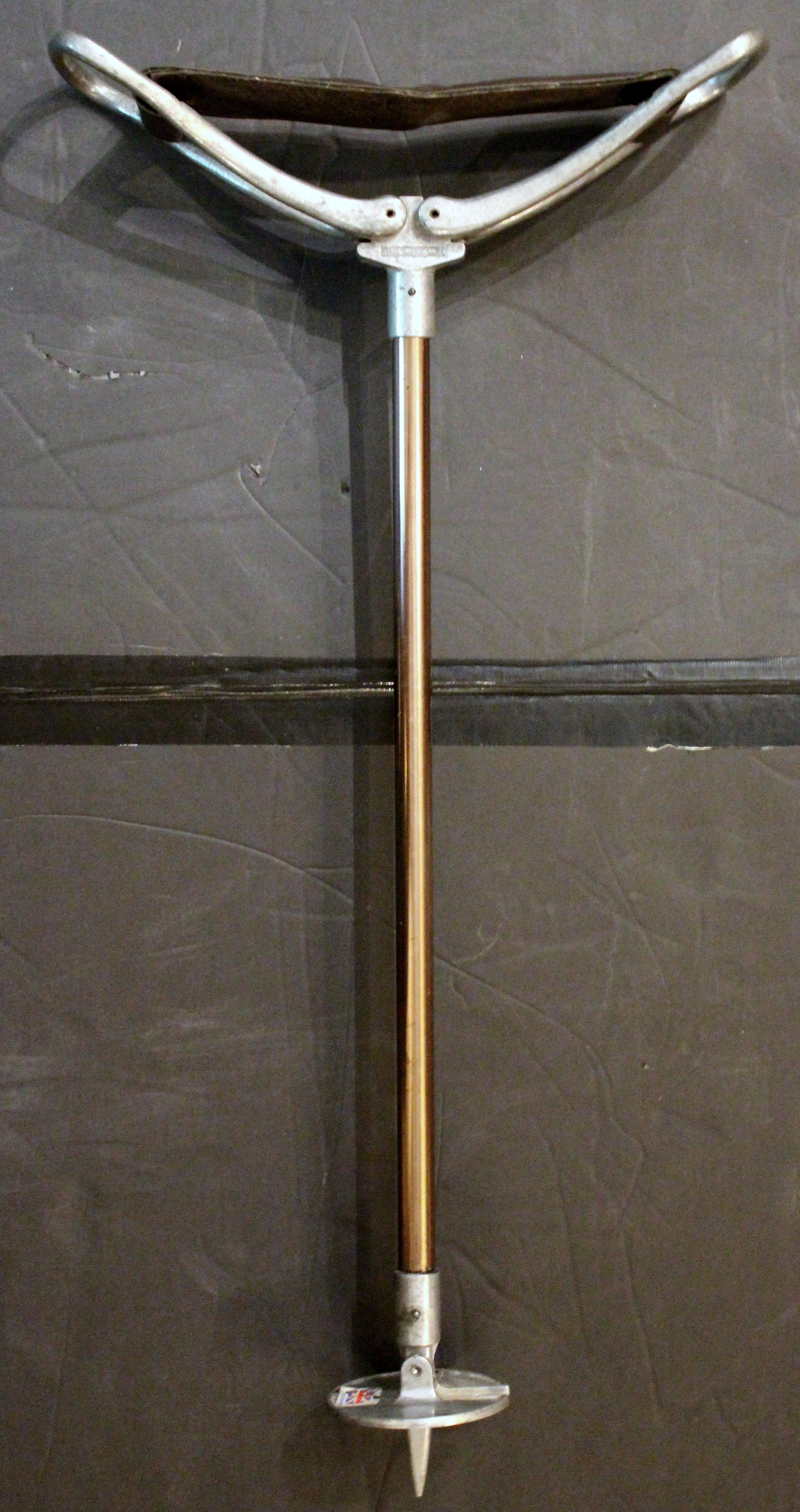 Circa 1960s English sporting event or hunting walking stick with folding seat. Steel with coppered finish shaft, leather seat. 