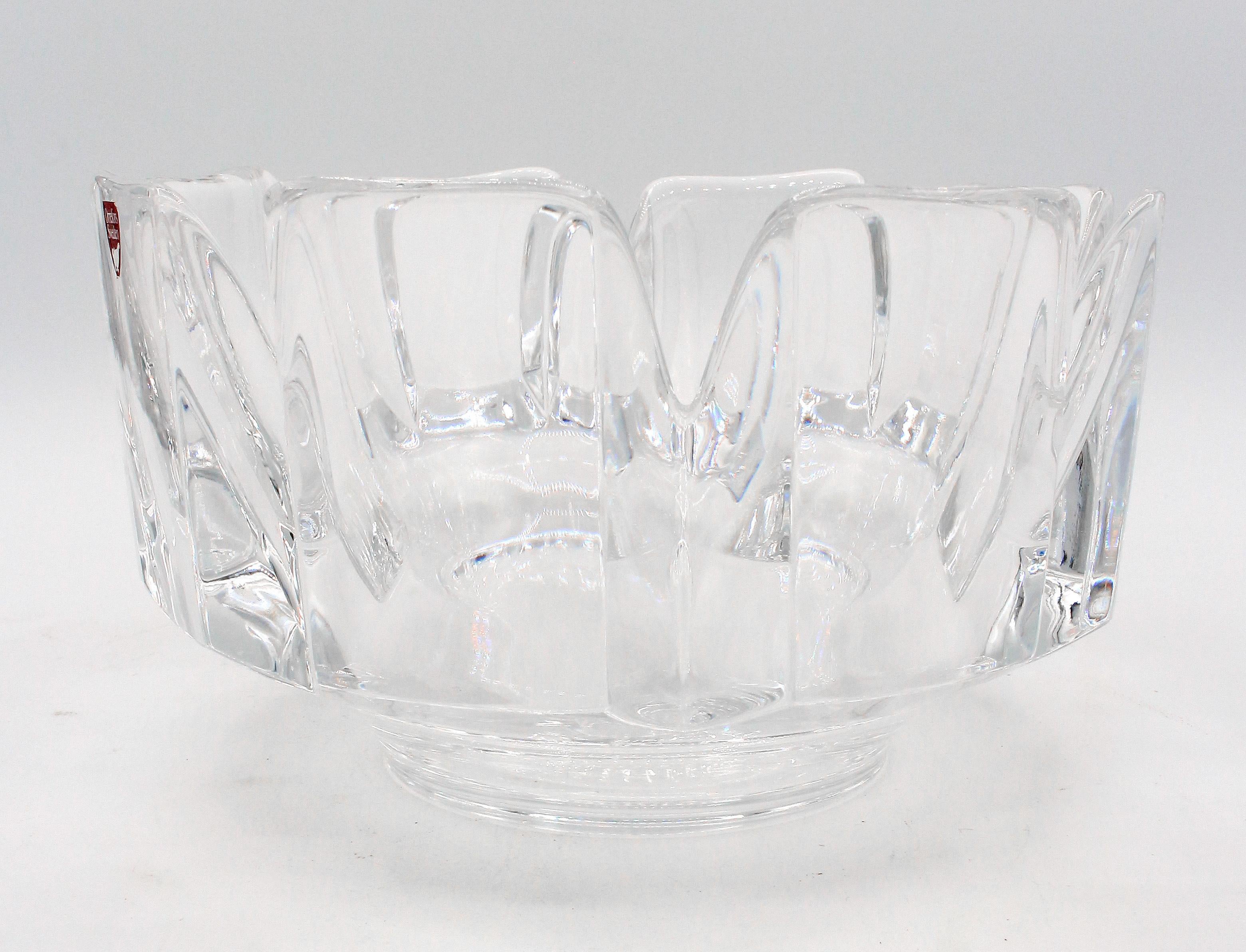 Mid Century Modern glass bowl by Orrefors, circa 1960s, designed by Lars Hellsten. 8 petal bowl known as the Corona bowl. Retains label: Orrefors Sweden. Signed: Orrefors, LH4384-131.
7 3/8