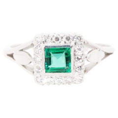 Circa 1960s Natural Green Emerald and Diamond Cluster Ring 18 Carat White Gold