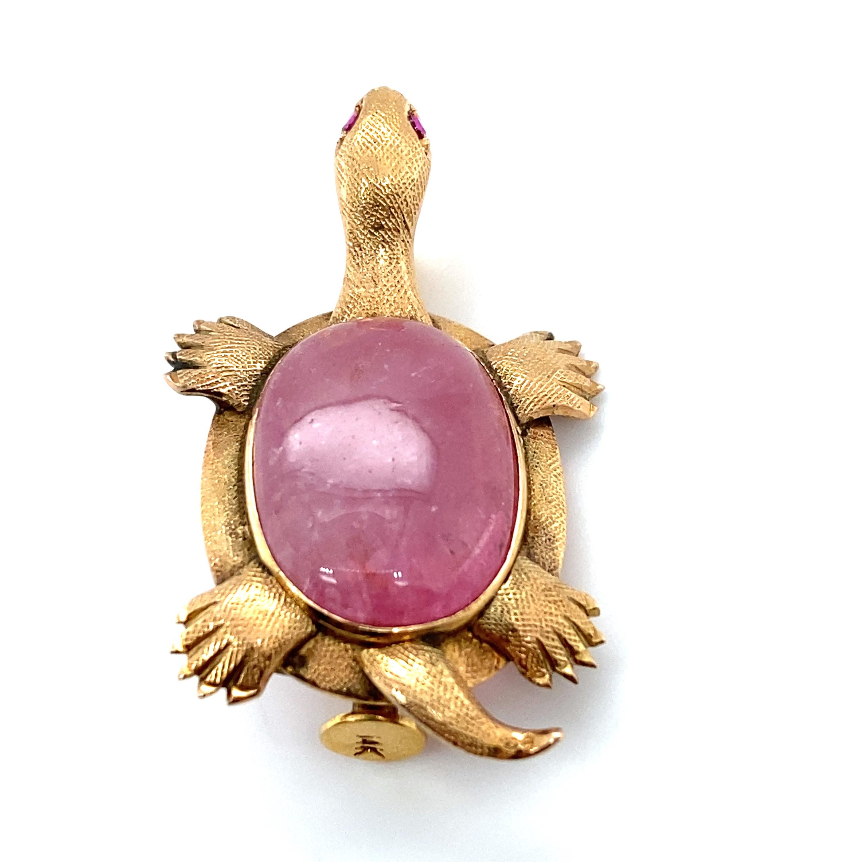 Item Details: This whimsical turtle brooch has a large oval pink tourmaline and is made of brushed 14 karat gold. The eyes are set with small rubies. It is the most beautiful turtle with the perfect hues of pink and gold perfectly accenting each