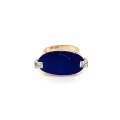 Circa 1960s Retro East-West Oval Lapis Lazuli and Diamond Ring in 14K Gold