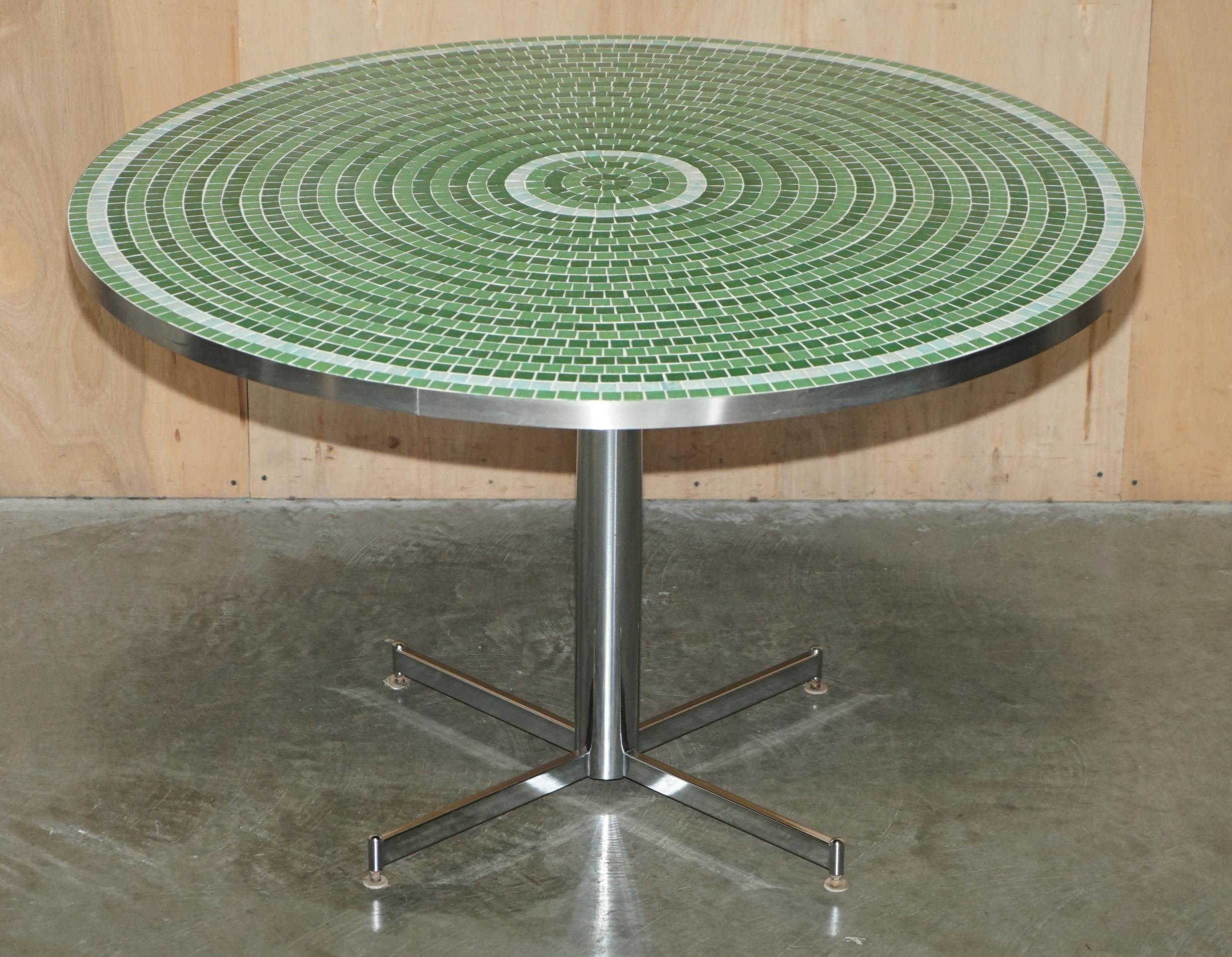 Royal House Antiques

Royal House Antiques is delighted to offer for sale this sublime, super decorative vibrant Green Mosaic tiled Chrome framed dining table

Please note the delivery fee listed is just a guide, it covers within the M25 only for
