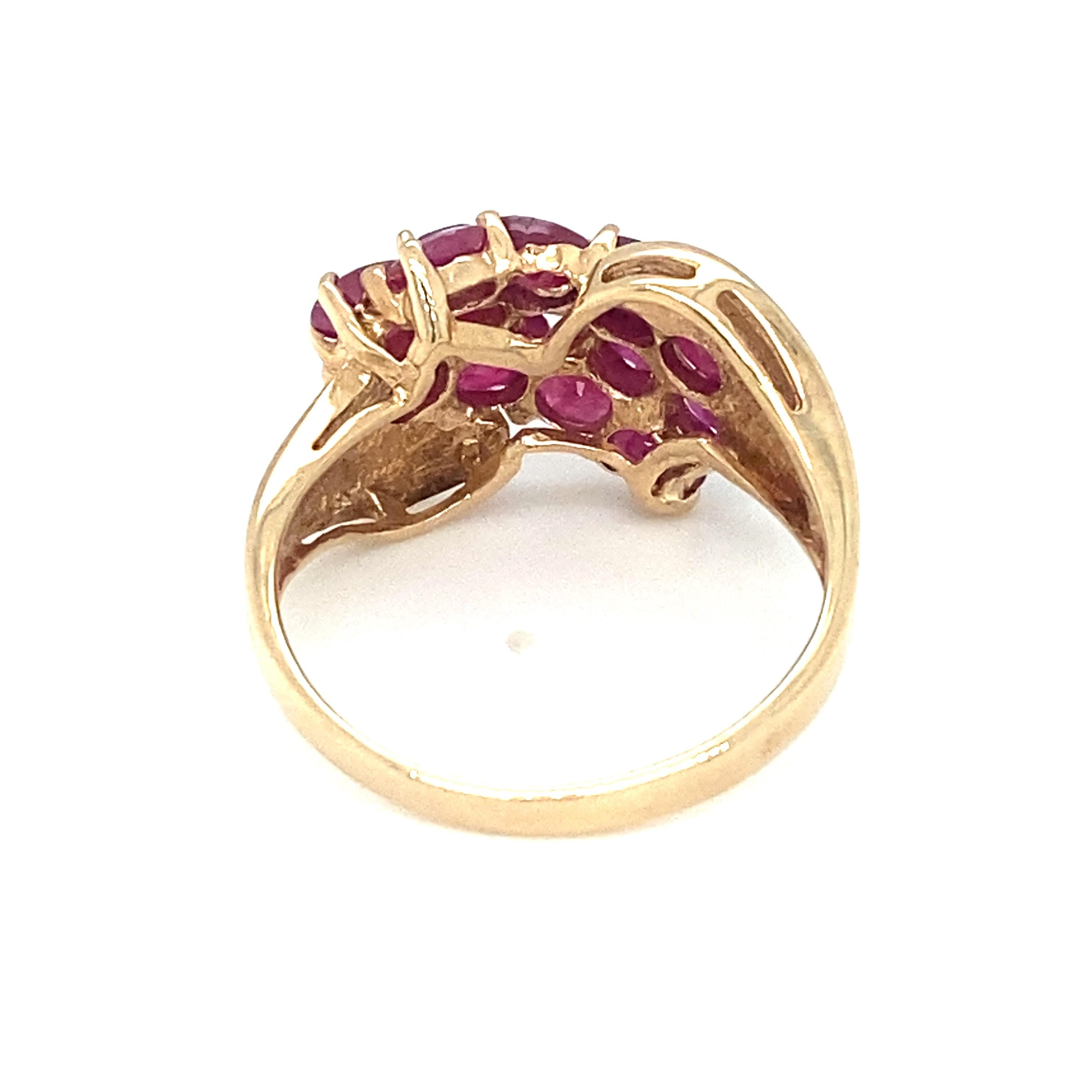 Item Details: This ring has three rows of round rubies and was made in Portugal.

Circa: 1960s
Metal Type: 10 Karat Yellow gold
Weight: 3.7 grams
Size: US 7, resizable