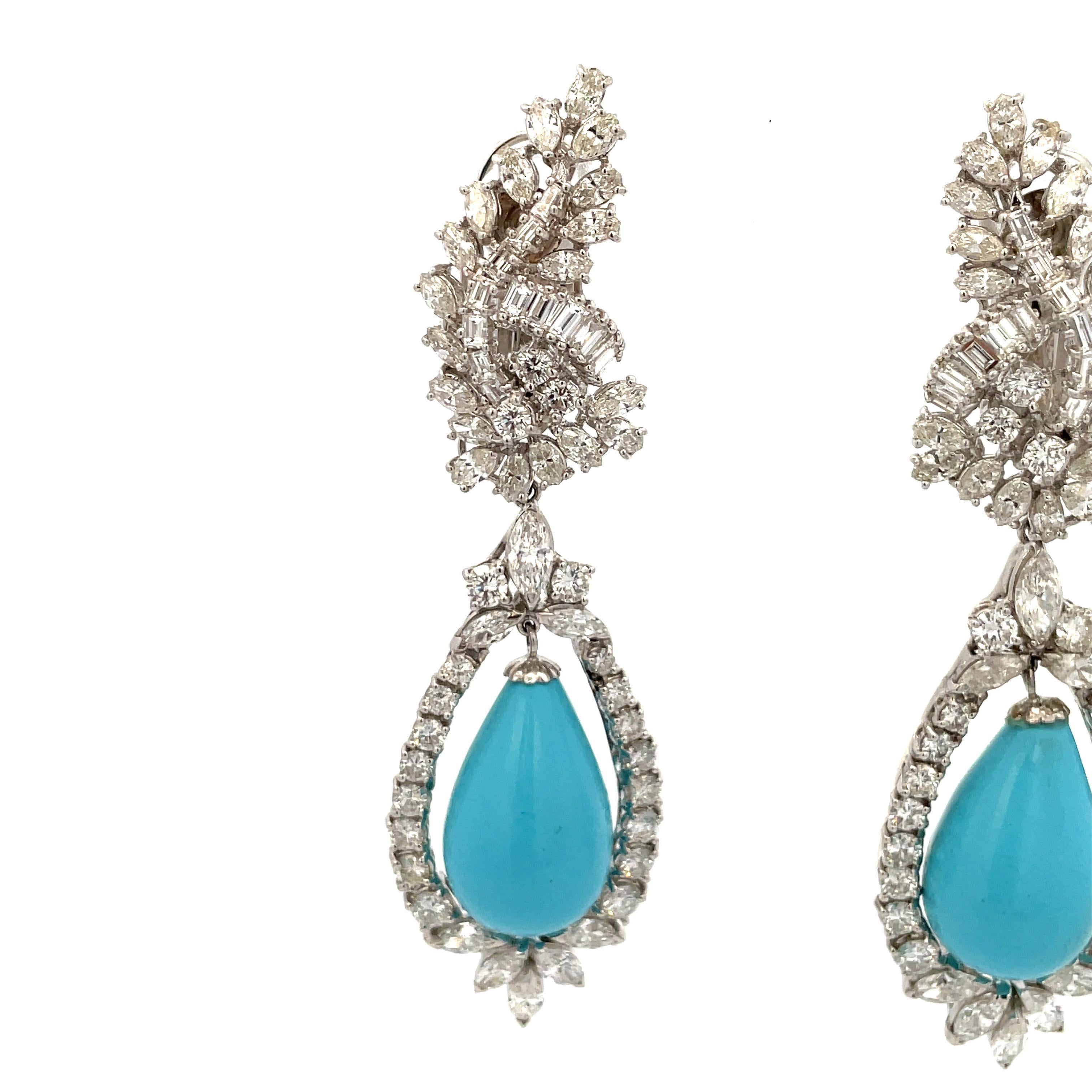 Platinum drop earrings featuring marquise, baguette and round brilliants weighing approximately 9.85 Carats with two Turquoise measuring 22 * 13 mm, circa 1960s. 