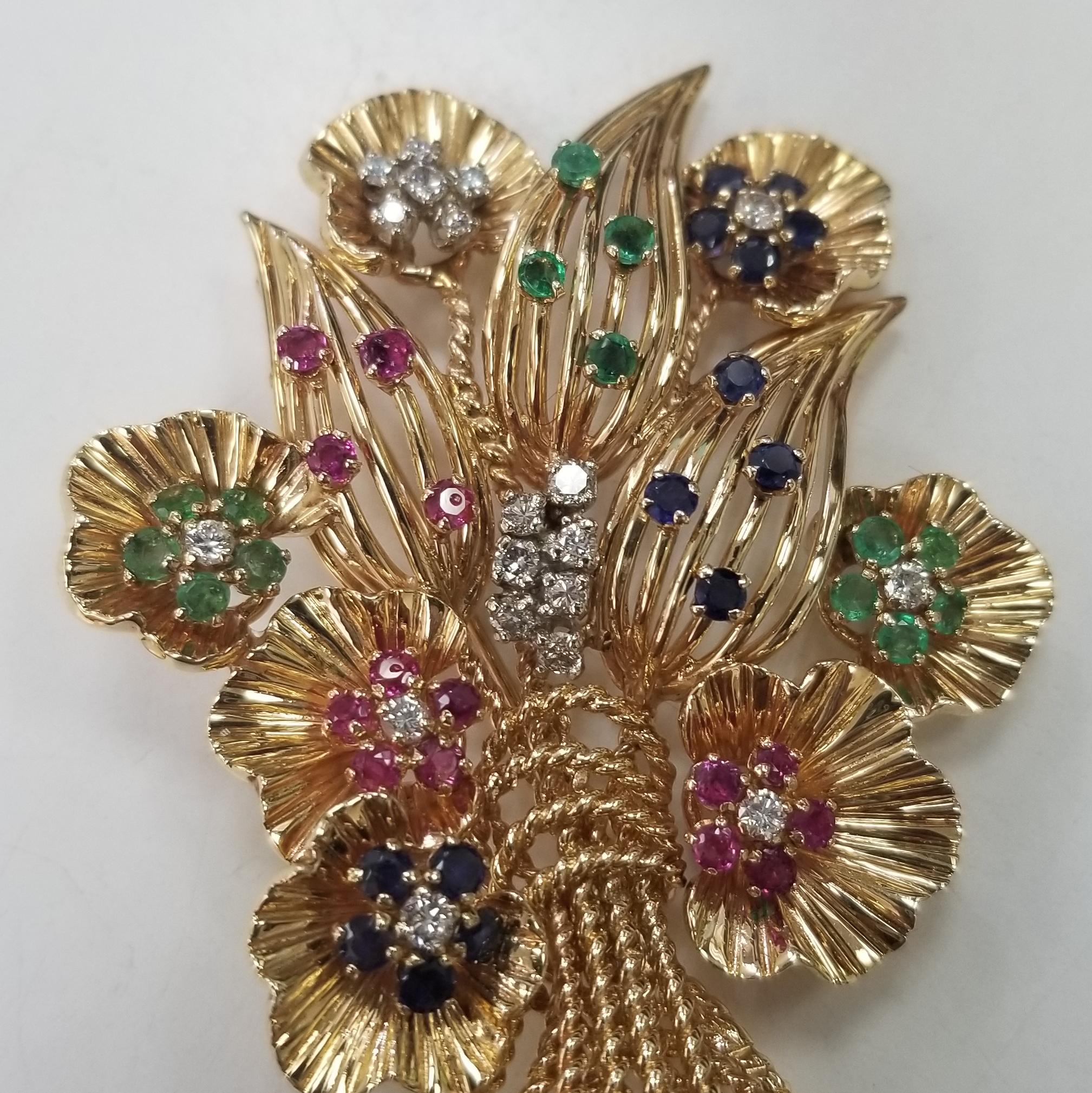 This one of a kind 14kt yellow gold  Circa 1960's with diamonds and gemstones in flower brooch is a must have addition to your jewellery box. The perfect gift for a loved one this stunning brooch has been delicately been hand made to