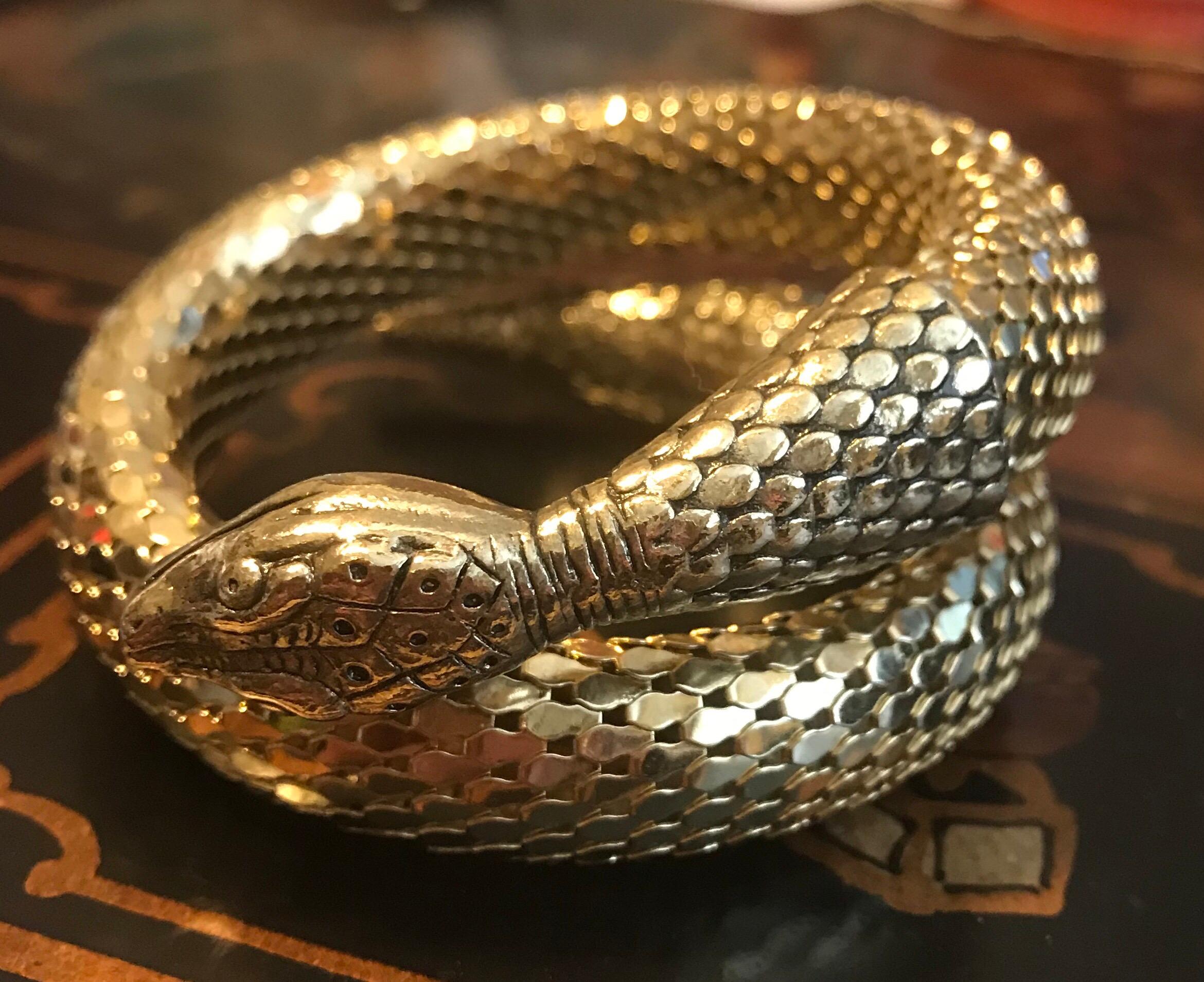 Circa 1960s Whiting and Davis, bright gold tone metal mesh, coiled snake bracelet.  The piece is made on a strong memory coil that will hold it's shape and measures 6.5