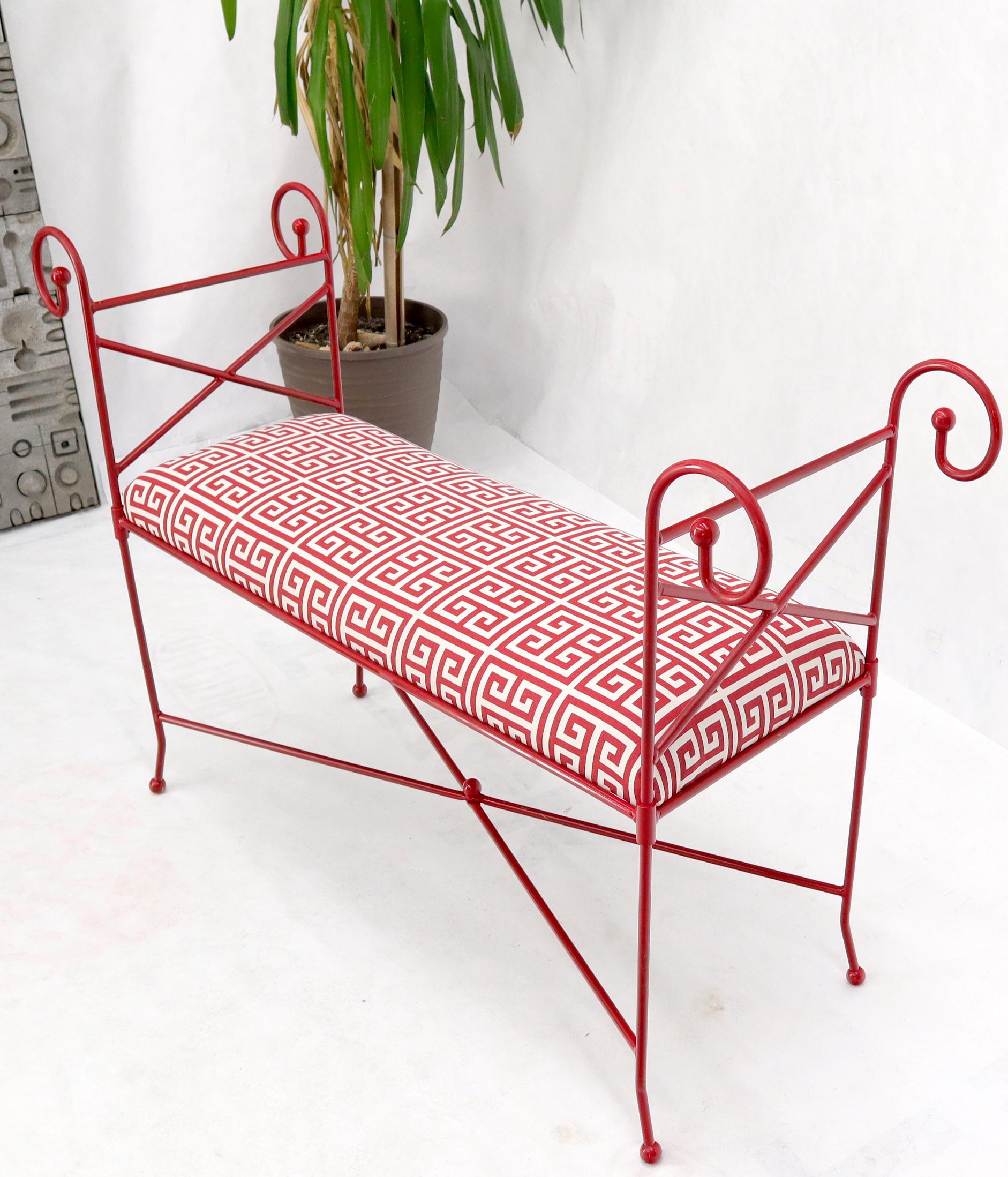 Fully restored Mid-Century Modern wrought iron window bench. New fire red lacquer finish and new Greek key style fabric upholstery.