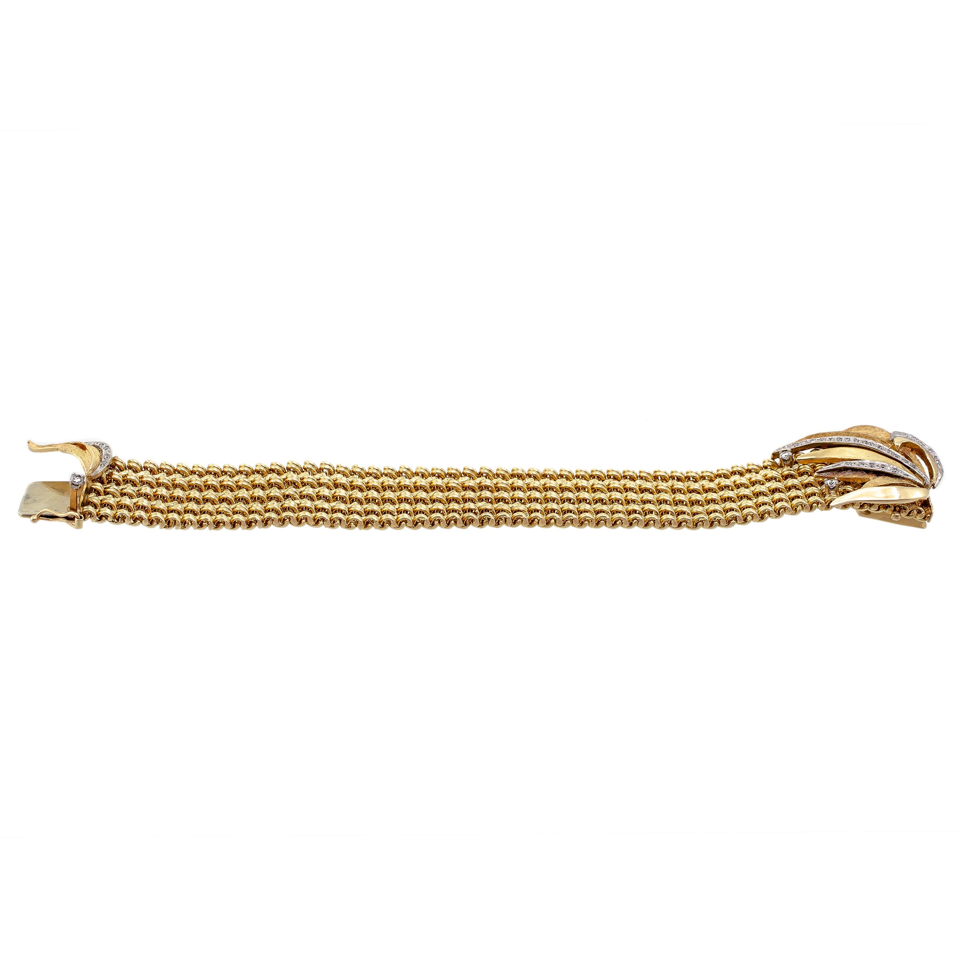 Beautiful Circa 1970 14k yellow gold and diamond spray wide flexible bracelet - sculpted floral leaf yellow gold diamond clasp set with three small round diamonds - wide heavy 14k yellow gold braided bracelet - hidden clasp - length 6 3/4