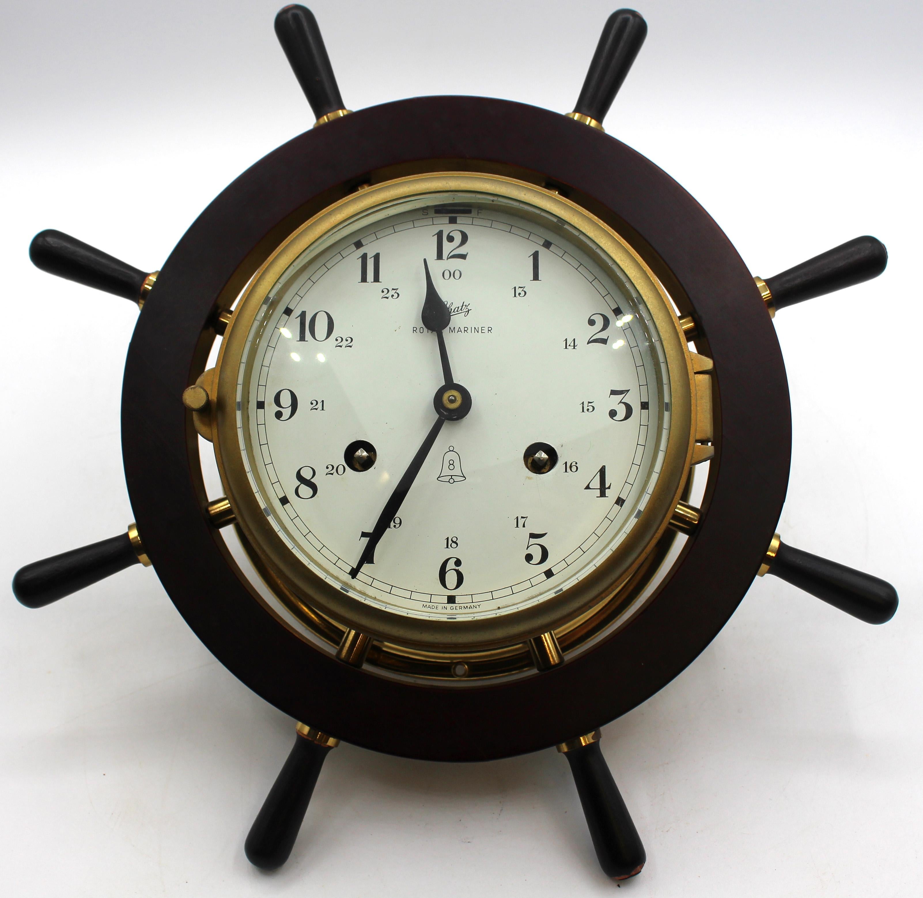 Circa 1970 ship's wheel clock & barometer set by August Schatz & Sohne, Germany. Royal Mariner clock is running; strikes hours & 1/2 hour; 8-day movement. Brass, mahogany & ebony finish. 13