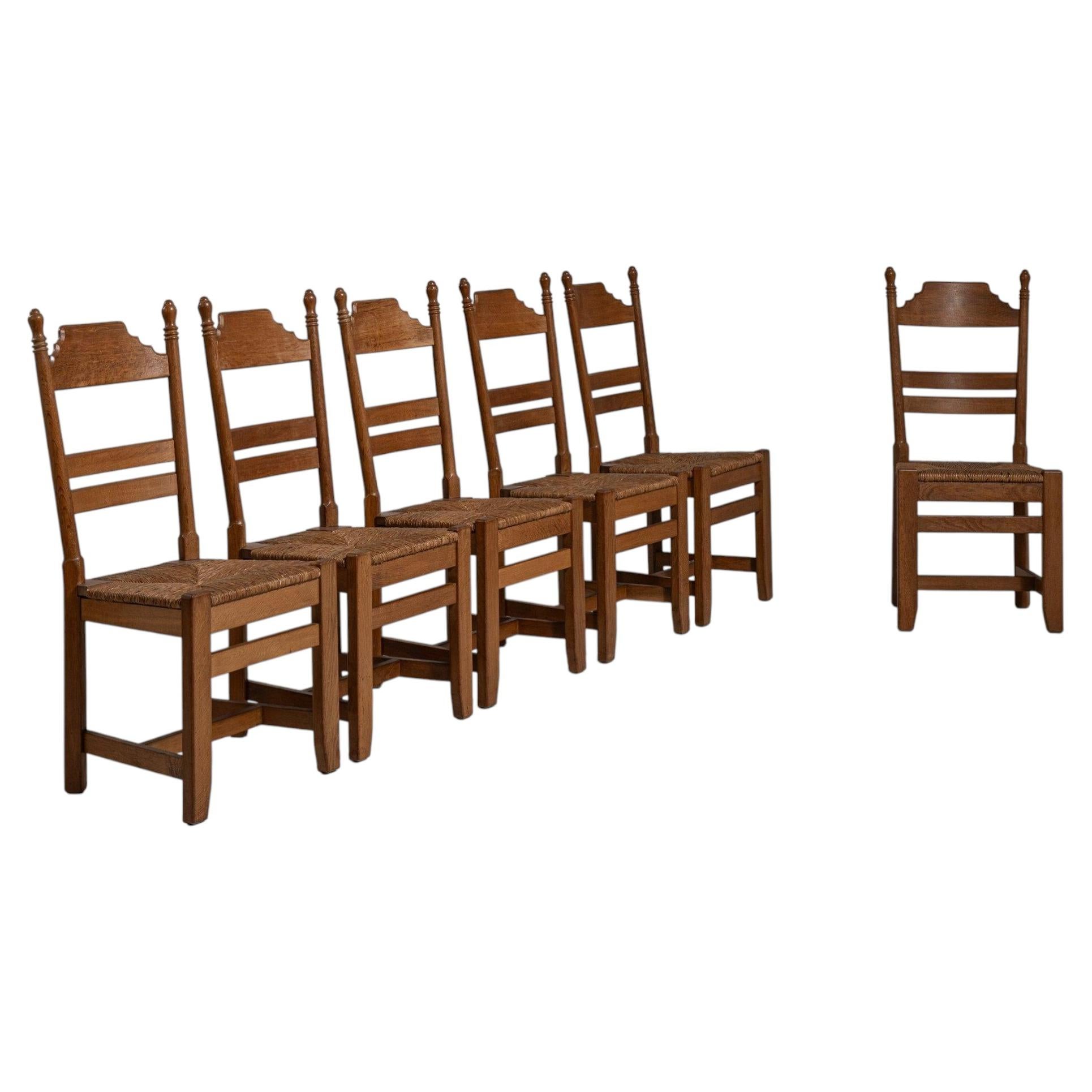 Circa 1970 Honey Wood Set of Six Oak Dining Chairs with Cane Seats For Sale