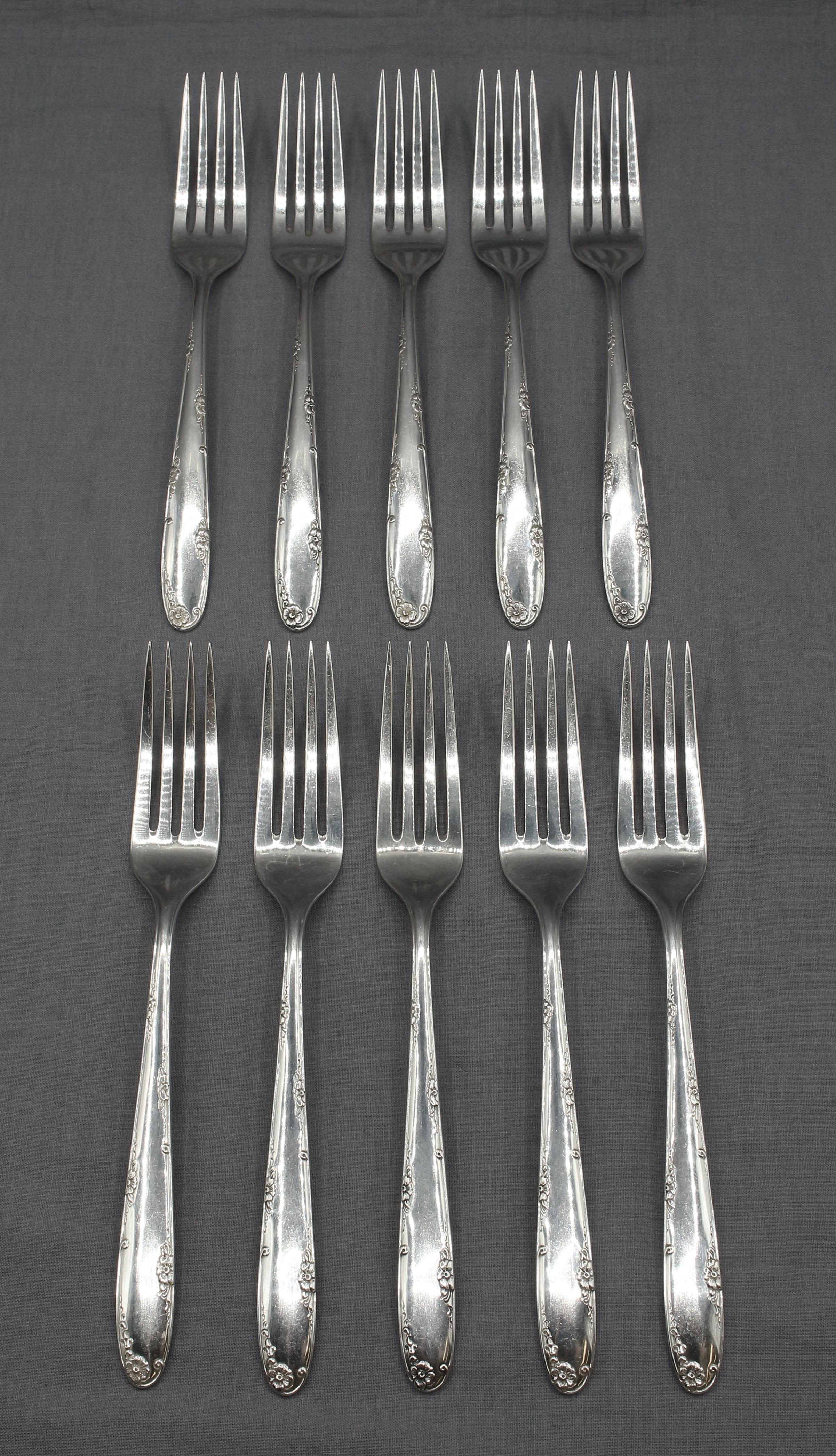 Circa 1970 Madeira by Towle Sterling Silver 59-piece Flatware Set. 1948 pattern. Ten 4-piece place settings: 10 dinner forks, 10 dinner knives, 13 salad forks, 16 teaspoons, plus 2 host forks & 2 host knives & 6 serving pieces. 62.35 troy oz. Knives