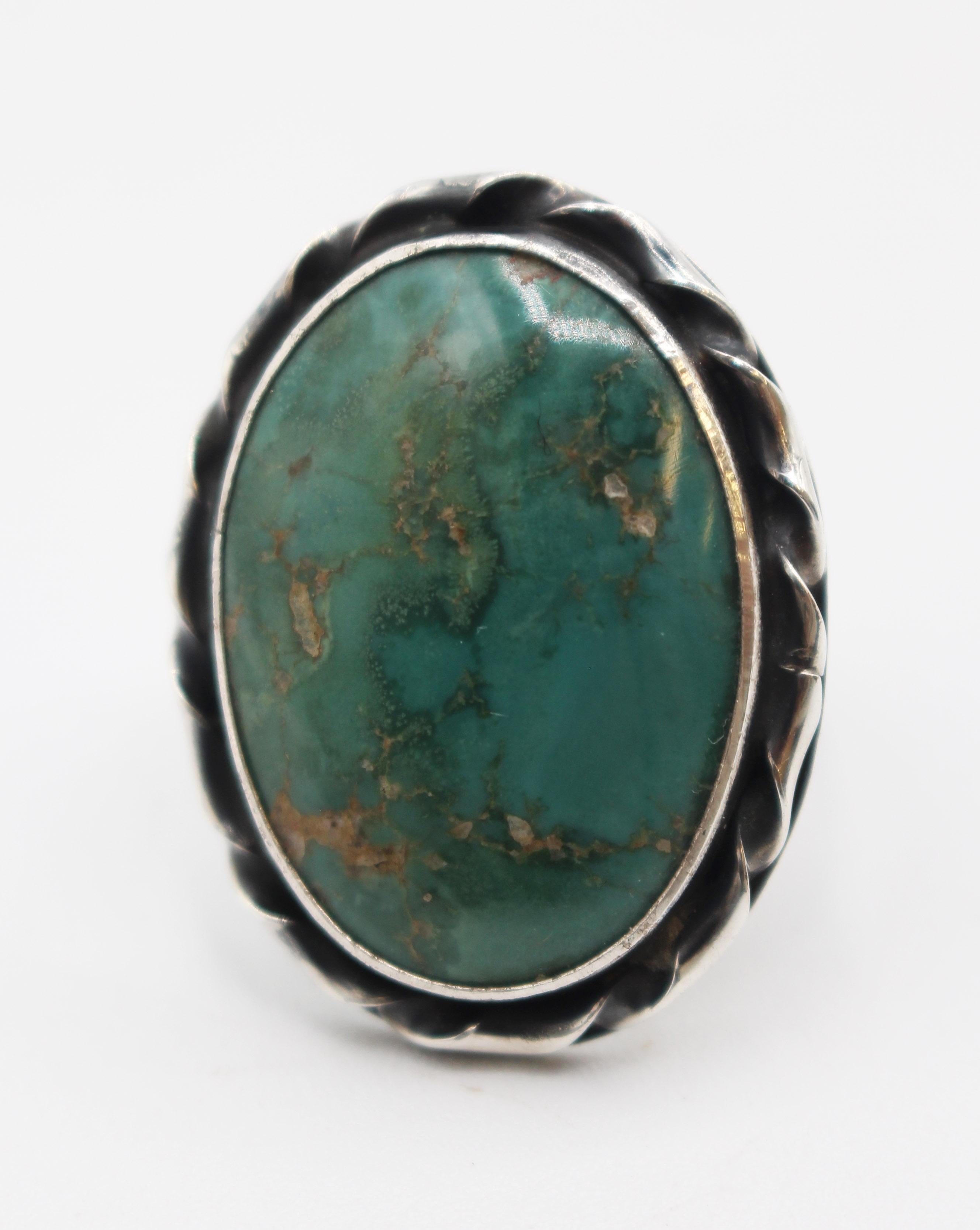 Circa 1970 Royston Turquoise & silver ring, Native American. Unmarked except 2 symbol signature. Fine craftsmanship. 10 grams. Size 7.
