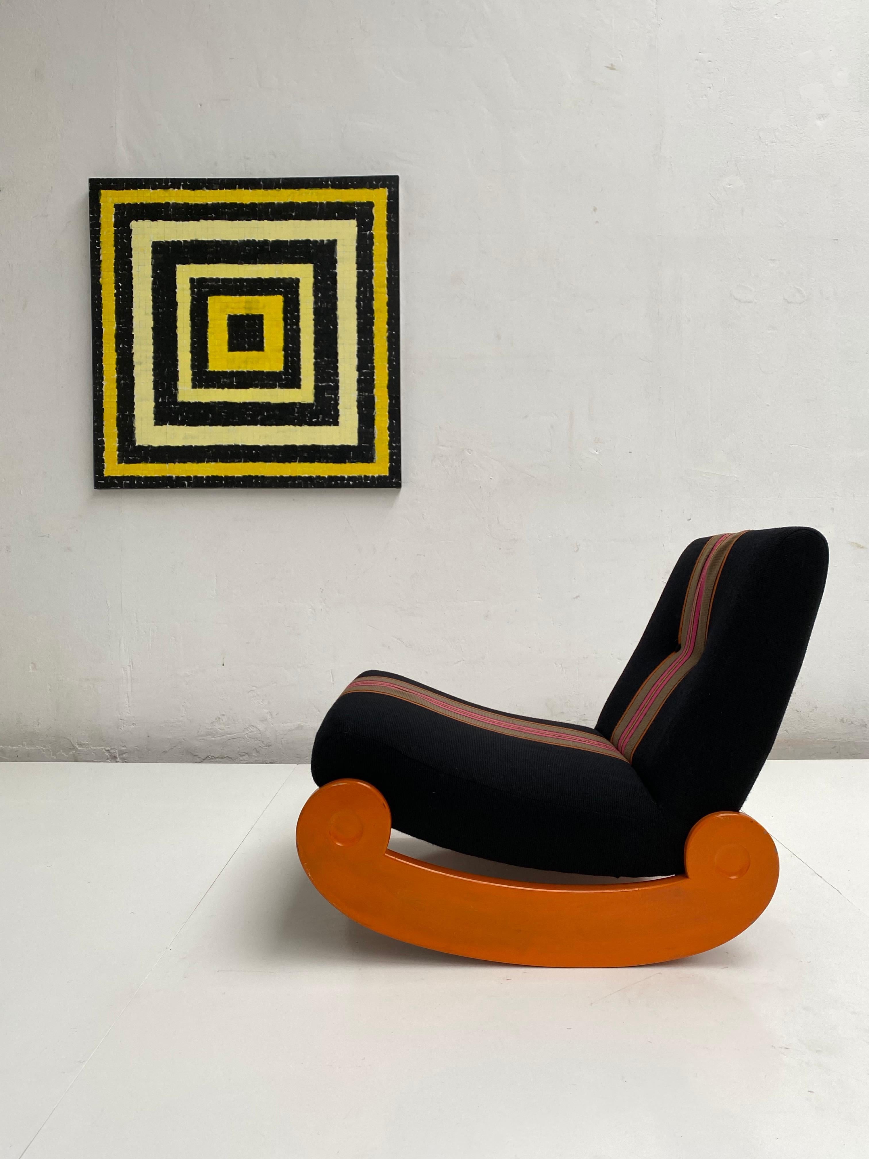 This 1970 rocking chair has its original first owner custom ordered funky wool fabric

The chair was purchased circa 1970 and was reupholstered in 1972 with this typical 1970s wool upholstery to match a modular sofa by Klaus Uredat for Cor

We