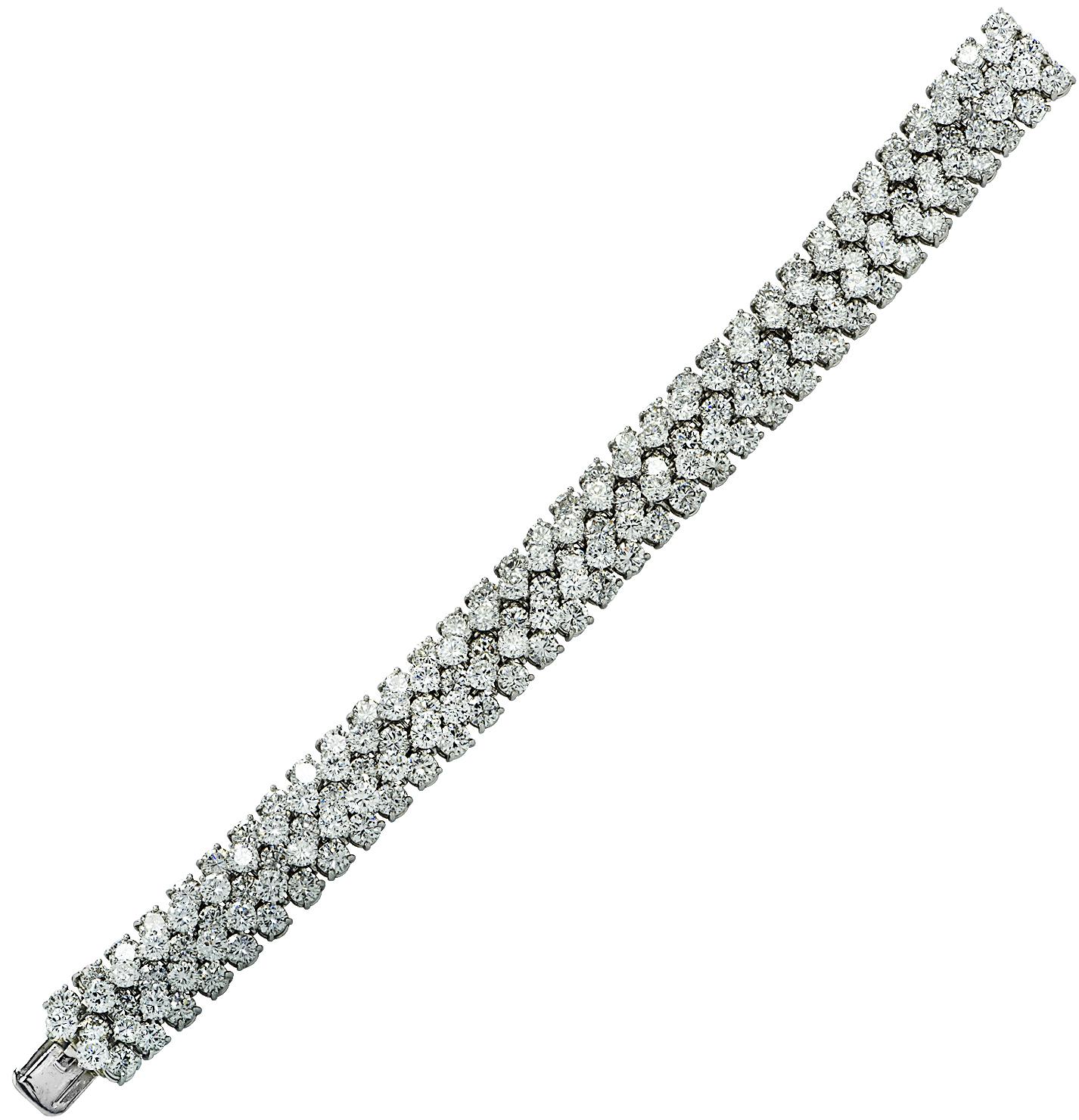 Spectacular Oscar Heyman diamond bangle bracelet Circa 1970, finely crafted by hand in platinum, featuring 170 round brilliant cut diamonds weighing approximately 30 carats total, E color, VS clarity. Dynamic layers of diamonds, varying in size,