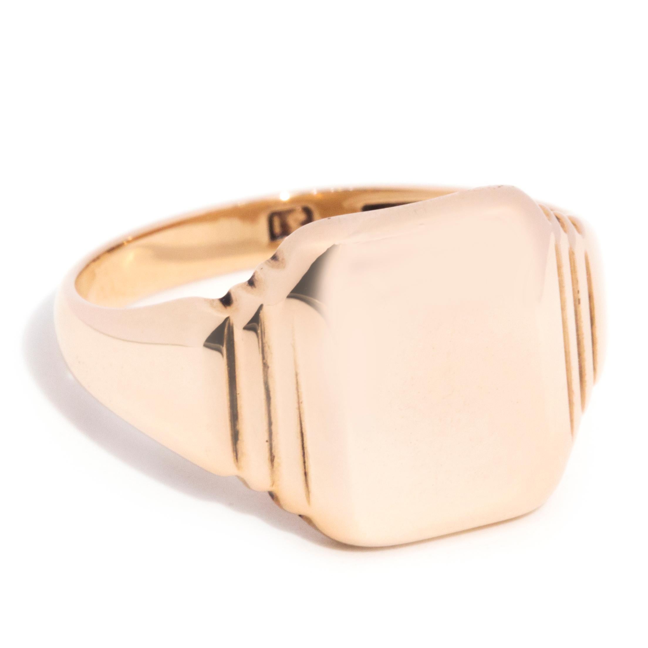 Forged in 9 carat rose gold, this handsome men's signet ring features a high polish curved band flowing into grooved shoulders and an unmarked rectangular platform with room for personalised engraving. We have named this dapper vintage jewel The