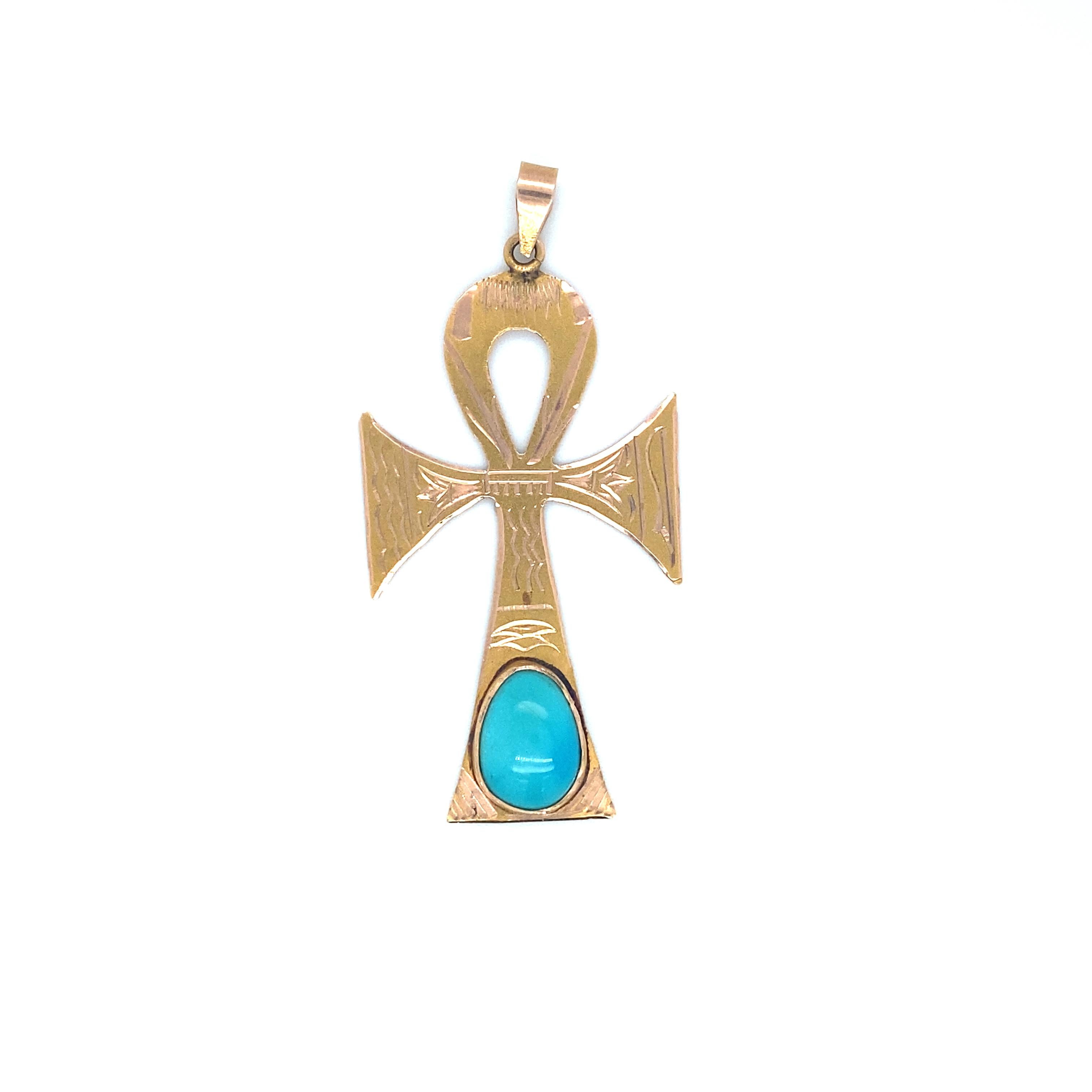 Item Details: This vintage pendant in the shape of an ancient Egyptian ankh symbol has a vibrant blue pear-shaped turquoise. It bears Egyptian gold hallmarks. This is a high quality 1970s pendant that is perfect for adding something groovy to any