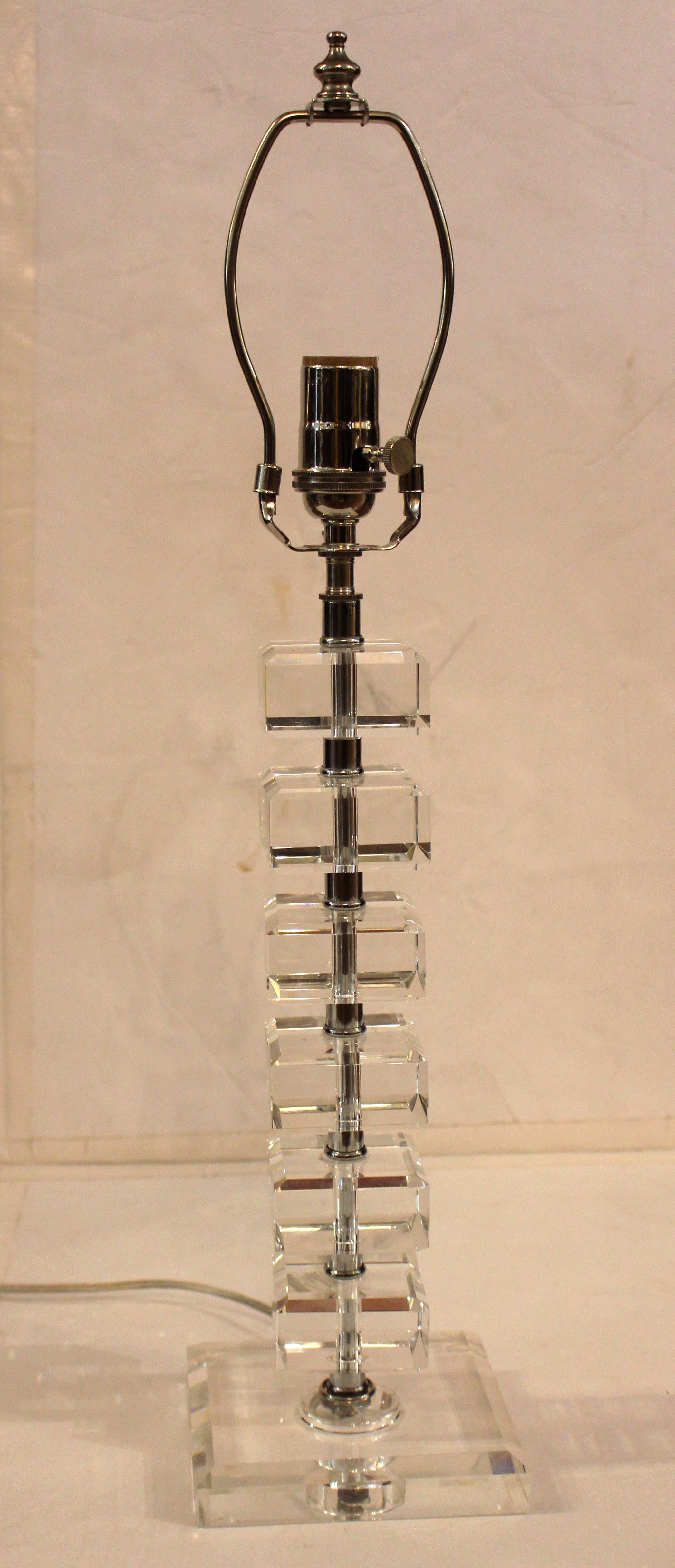 Circa 1970s cut crystal block table lamp, England. Built of champhered square crystal blocks. Fine condition. Re-wired for USA.
18 5/8