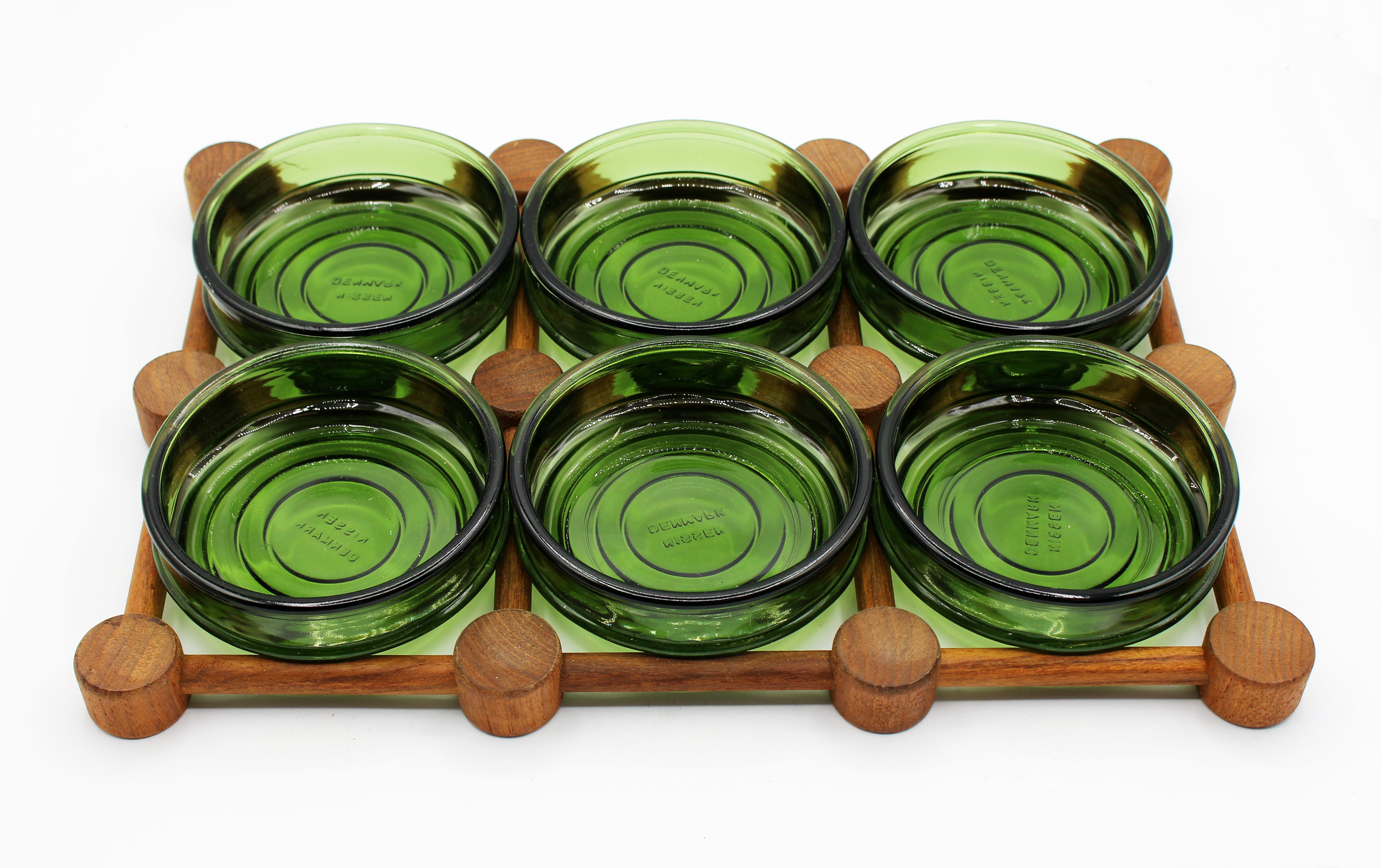 Circa 1970s Nissen cabaret set, Mid-Century Modern. Teak tray with 6 green signed glass serving bowls.

Measures: 15 1/8
