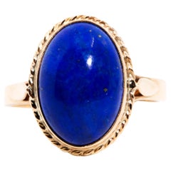 Circa 1970s Oval Blue Lapis Lazuli Cabochon Vintage Ring in 10 Carat Yellow Gold