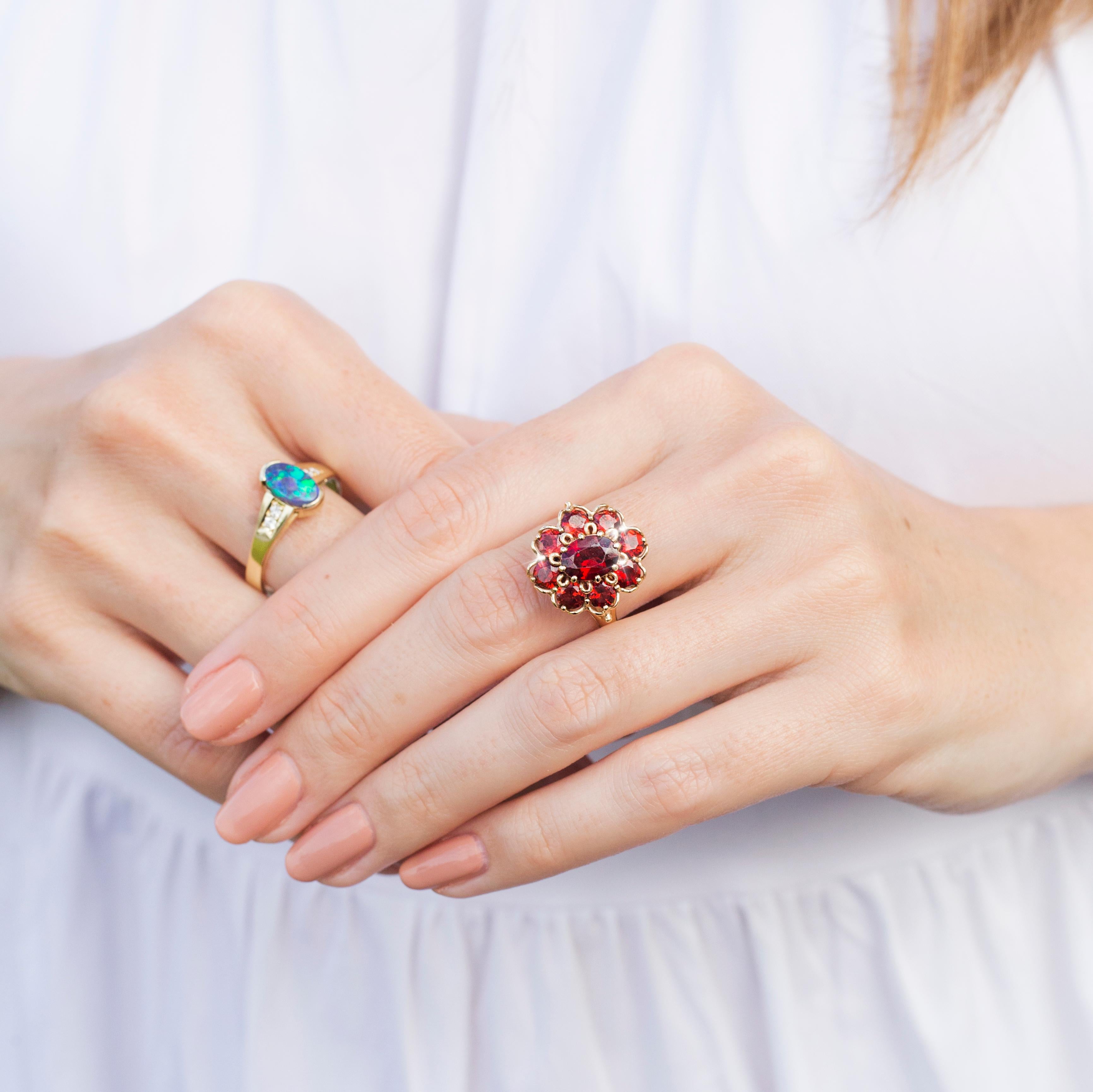 Circa 1970s Red Oval Garnet Vintage Halo Cluster Ring in 9 Carat Yellow Gold 6