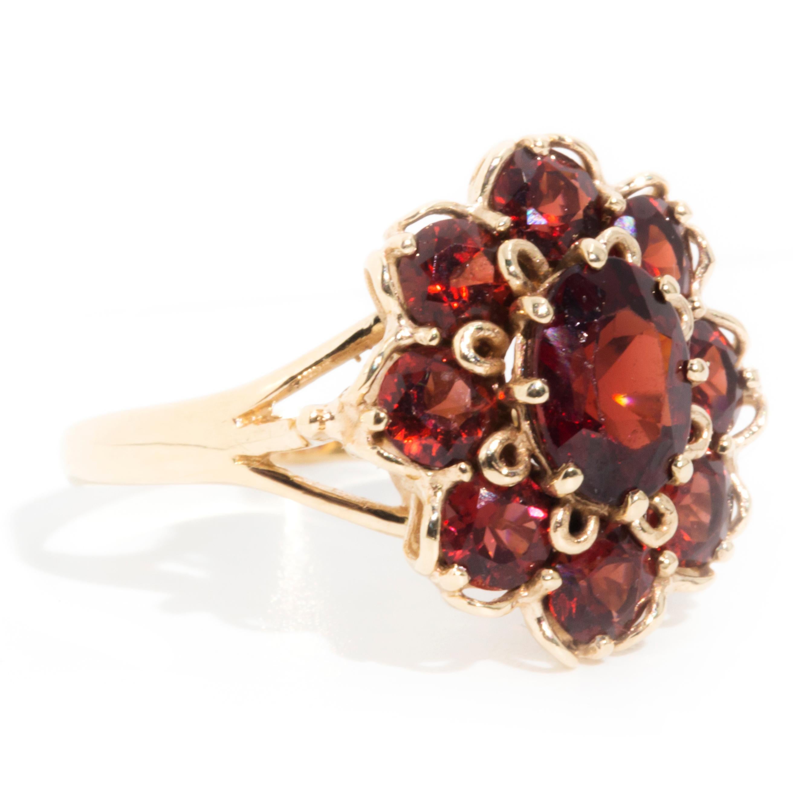 Circa 1970s Red Oval Garnet Vintage Halo Cluster Ring in 9 Carat Yellow Gold In Good Condition In Hamilton, AU