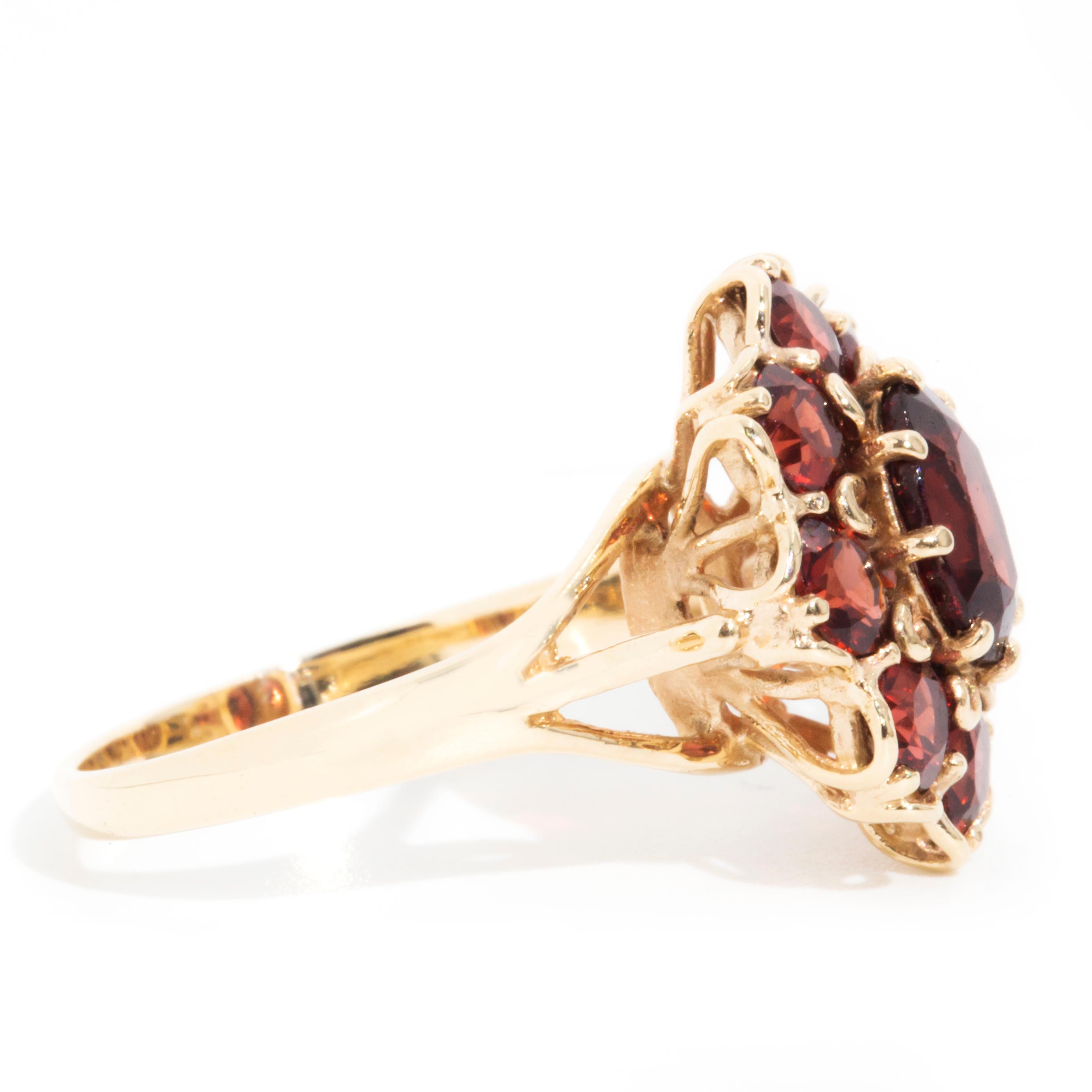 Circa 1970s Red Oval Garnet Vintage Halo Cluster Ring in 9 Carat Yellow Gold 1