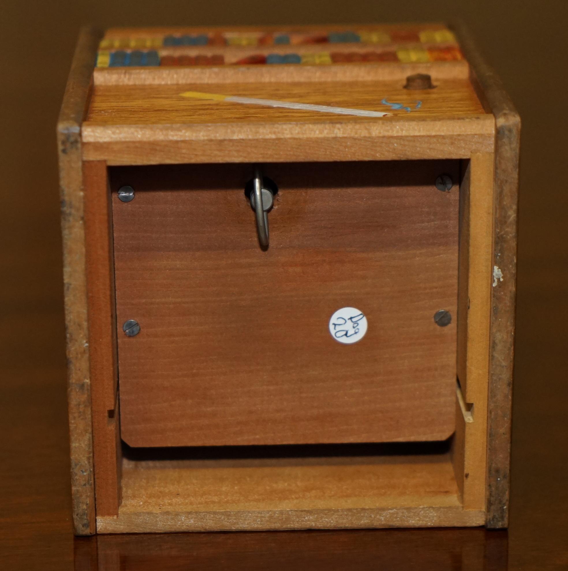 CIRCA 1970's RISING DOG MUSICAL MINIATURE FOLK ART CIGARETTE CIGAR DISPENSER For Sale 2