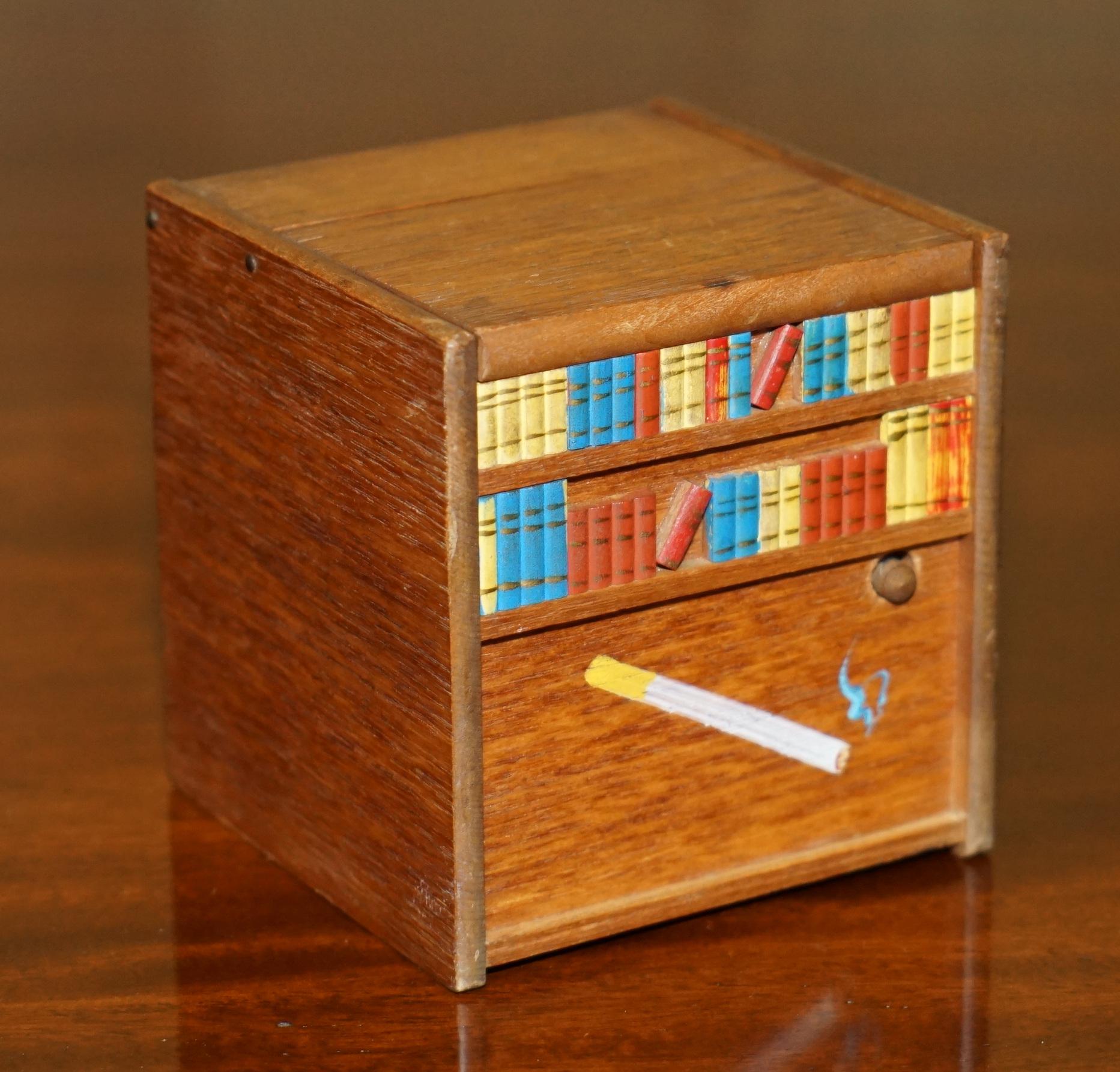 Royal House Antiques

Royal House Antiques is delighted to offer for sale this lovely miniature Folk Art musical Cigarette or Cigar dispenser circa 1970’s that features a rising dog 

This is part of a small suite, I have three in total, they are a