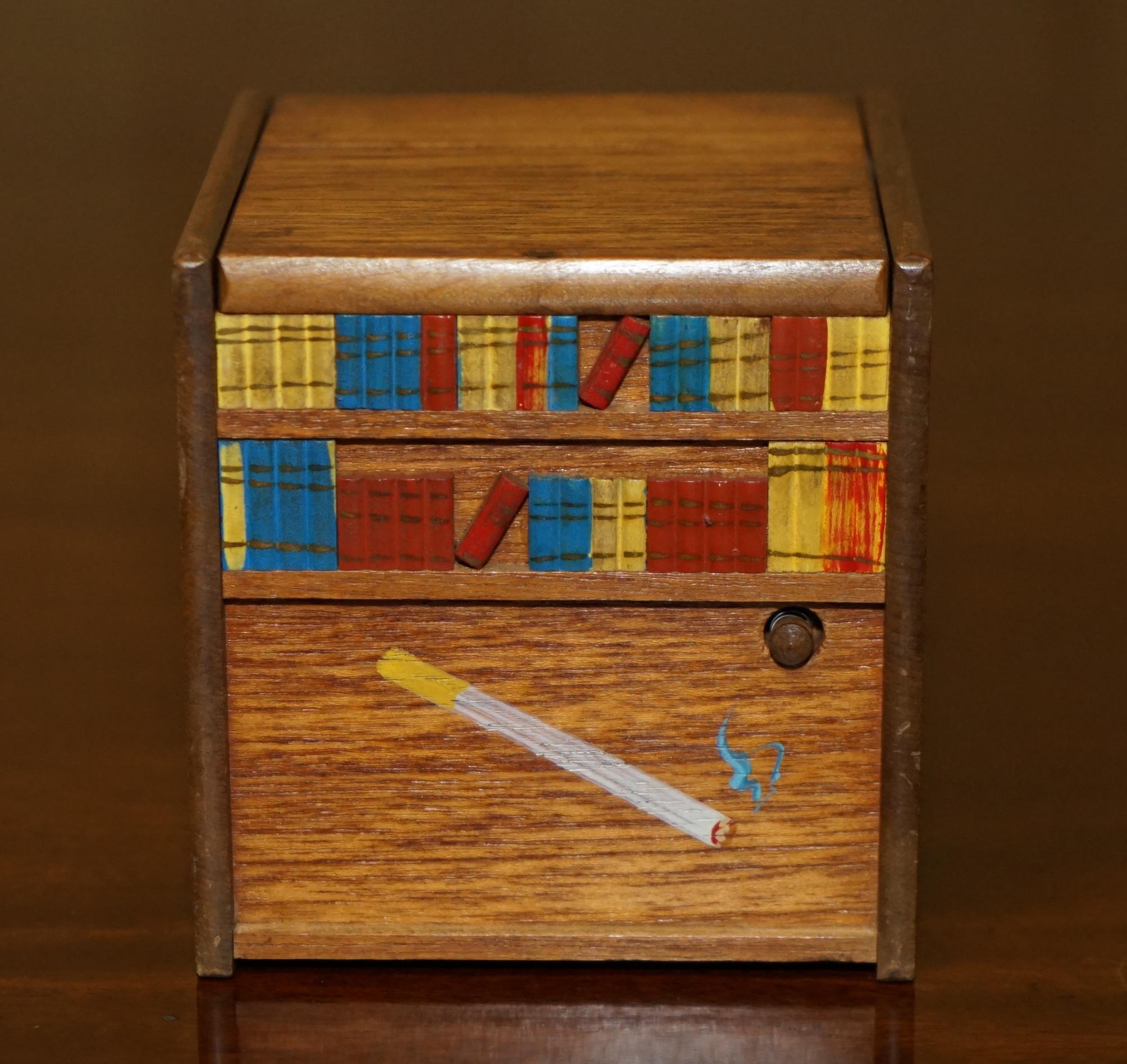Folk Art CIRCA 1970's RISING DOG MUSICAL MINIATURE FOLK ART CIGARETTE CIGAR DISPENSER For Sale