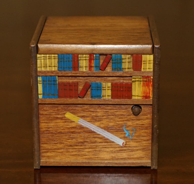 music box cigarette dispenser with dog CIRCA 1970's RISING DOG MUSICAL MINIATURE FOLK ART CIGARETTE CIGAR DISPENSER  For Sale at 1stDibs