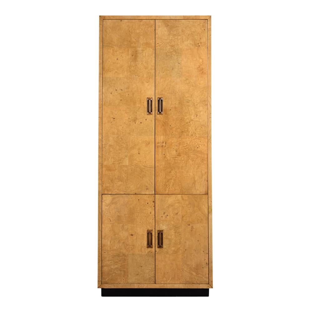 This Vintage 1970s Burled Wardrobe by Henredon has been restored and features its original veneer finish in good condition. The Scene Two Collection Wardrobe also has two large doors on the top and two small on the bottom all of which have carved