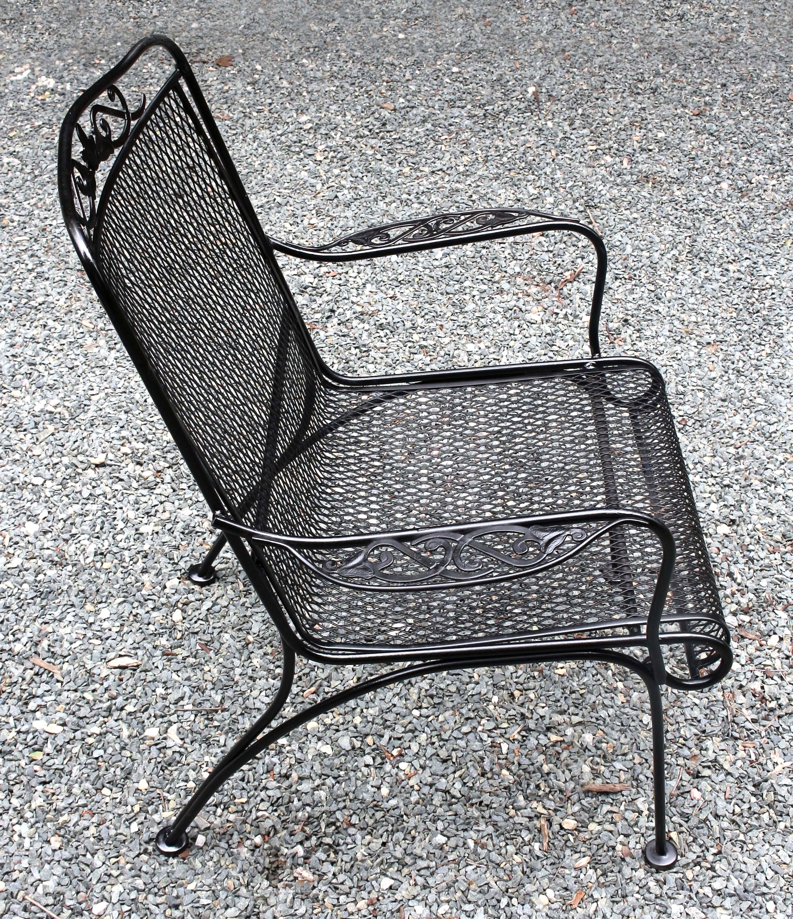 Wrought iron arm chair, c.1970s, probably by Russell Woodard. Leaf & scroll motif on crest & arms. Sturdy, arched, outswept back legs. Repainted.
26 5/8