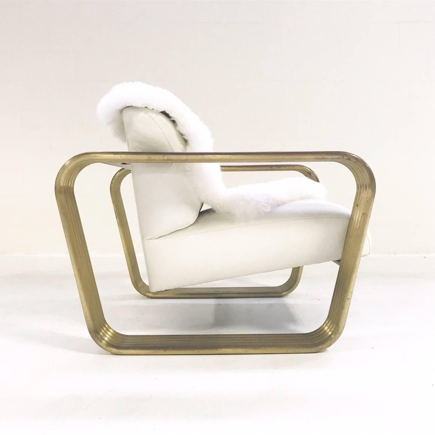 This Art Deco style Jay Spectre lounge chair (circa 1975) is in such excellent vintage condition we didn't even wanna touch it!  The tubular brass is perfectly worn and perfectly stellar, the white leather is supple and smooth.  The only our touch