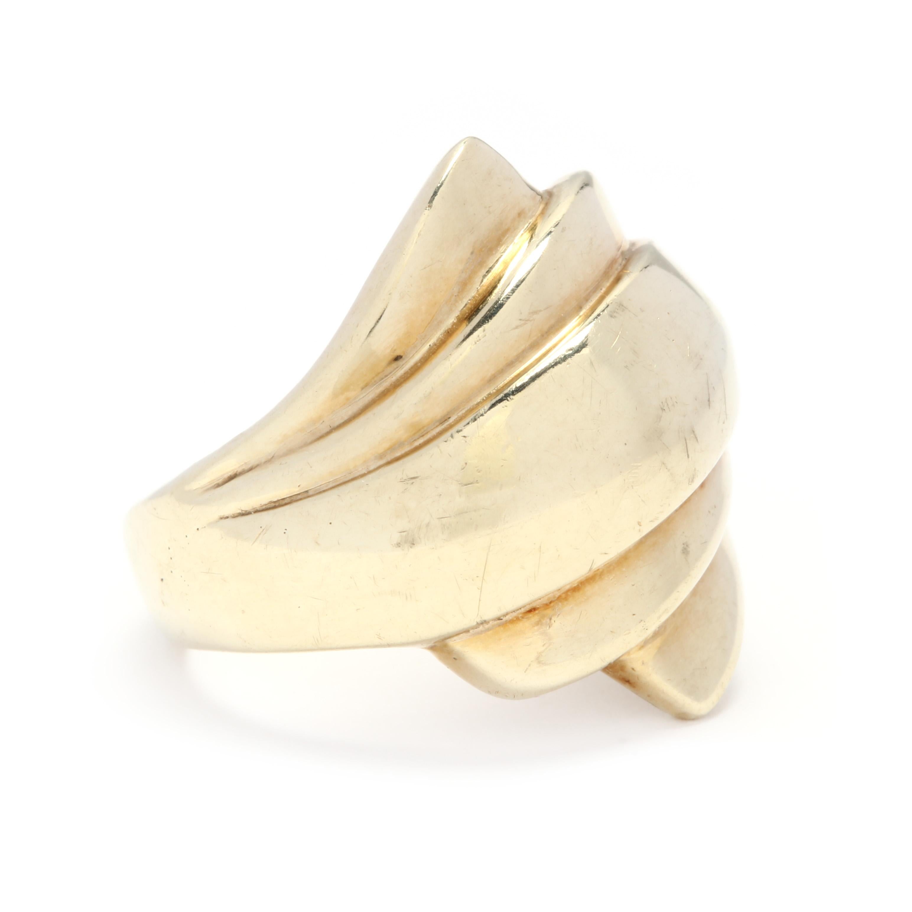 Circa 1980's, a 14 karat yellow gold ridged bypass ring. This ring features geometric bypass design with ridged detailing. We are IN LOVE with this ring. A big chuck of gold but light enough to not weigh you down in your busy life...The PERFECT