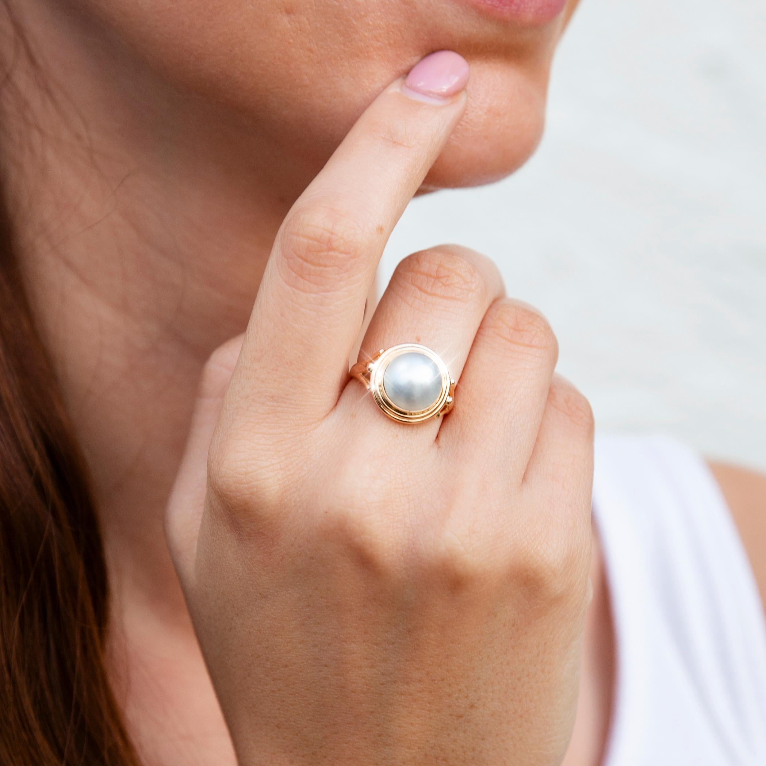 Forged in 9 carat yellow gold, this darling vintage ring features an alluring mabe pearl in a minimalistic rub over setting. We have named her The Elenore Ring. Her endearing design transitions seamlessly from day into evening, making her a