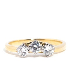 Circa 1980s Diamond Vintage 18 Carat Yellow Gold Three Stone Eternity Ring