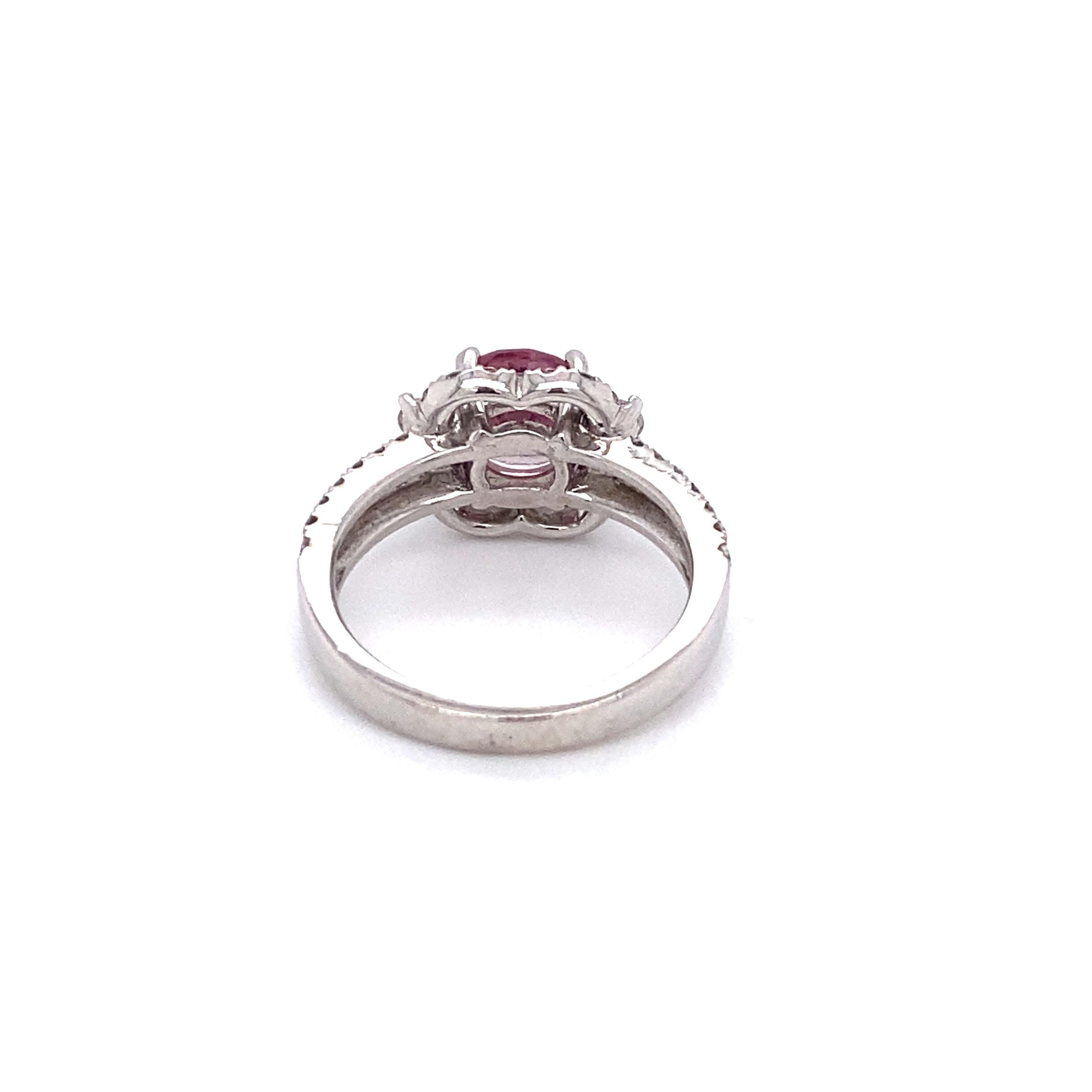 Circa: 1980s
Metal Type: 18 karat white gold
Size: US 5.5
Weight: 4.8g

Diamond Details:

Cut: Round brilliant
Carat: 0.45 carat total weight
Color: G
Clarity: VS-SI

Tourmaline Details:

Cut: Round
Carat: Approximately 0.80 carats
Minor wear and