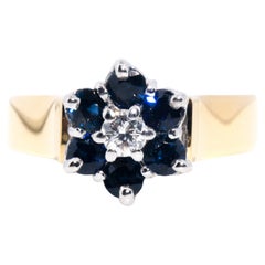 Circa 1980s Sapphire and Diamond Vintage 18 Carat Gold Flower Halo Cluster Ring