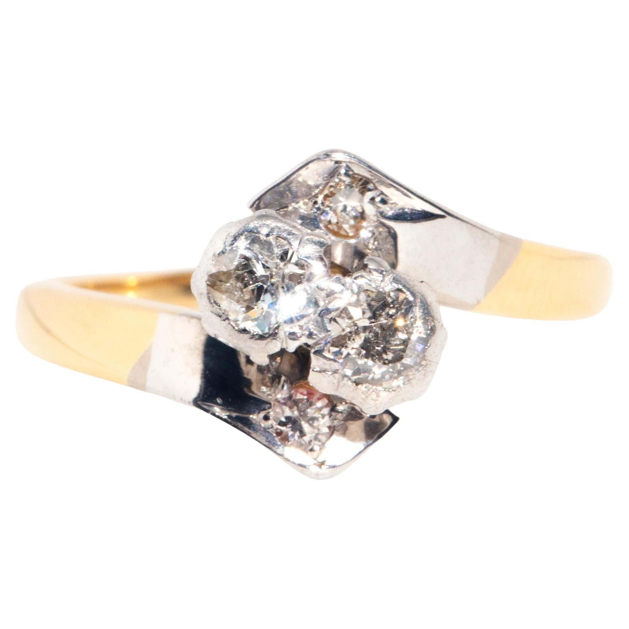 Circa 1980s "Toi Et Moi" 18 Carat Yellow and White Gold Diamond Crossover Ring For Sale
