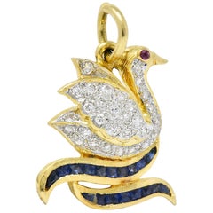 Circa 1980s Vintage 0.40 Carat Diamond Sapphire Ruby 18 Karat Gold Swan Charm