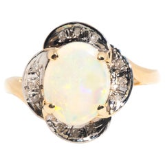 Circa 1980s Vintage White Crystal Opal and Diamond 14 Carat Yellow Gold Ring