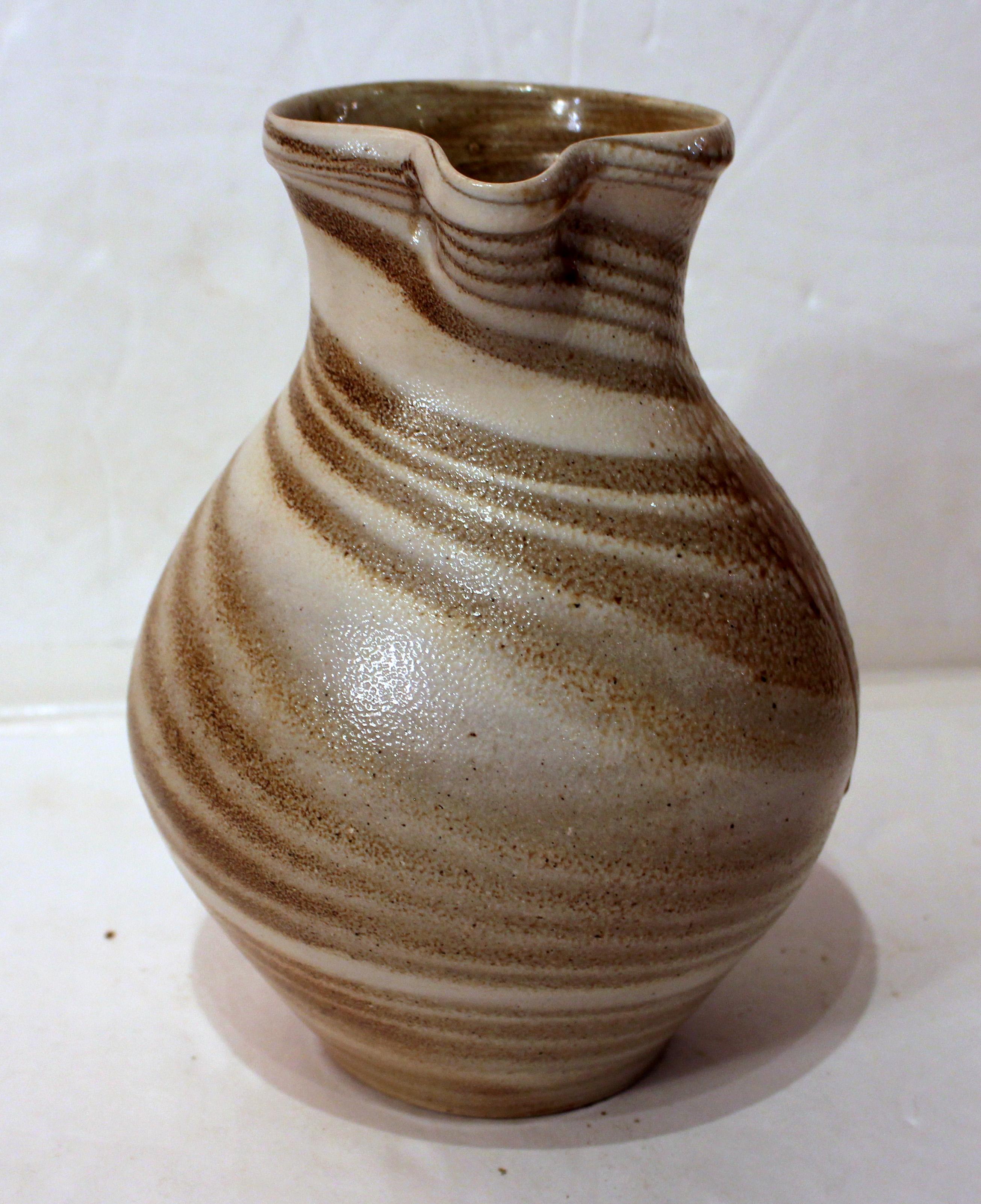 1984-1995 era pottery pitcher by Mark Hewitt. Signed. Swirl decoration & runs. Ash glaze. Provenance: Estate of Katharine Reid, former director Cleveland Museum of Art.
10