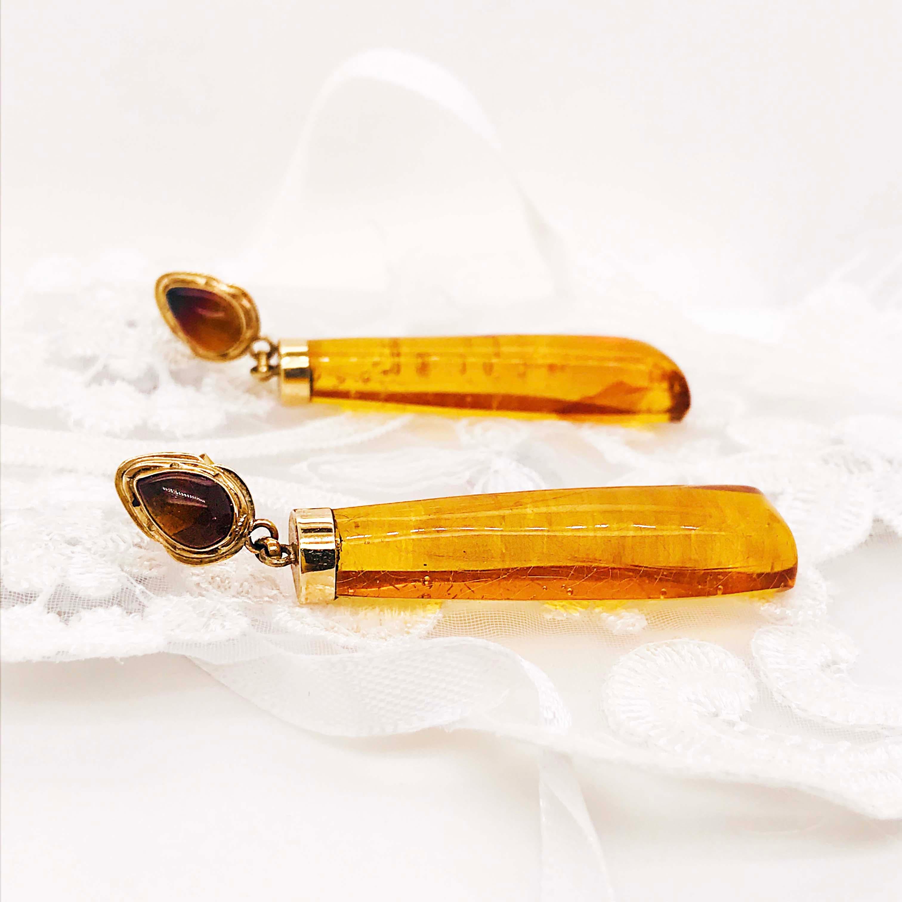 These Baltic Sea Amber earrings are one of a kind! CIRCA 1978 these earrings have amazing genuine amber pieces that have been hand made and polished to produce the most unique design. Baltic Sea amber was formed over 45 million years ago! It is used