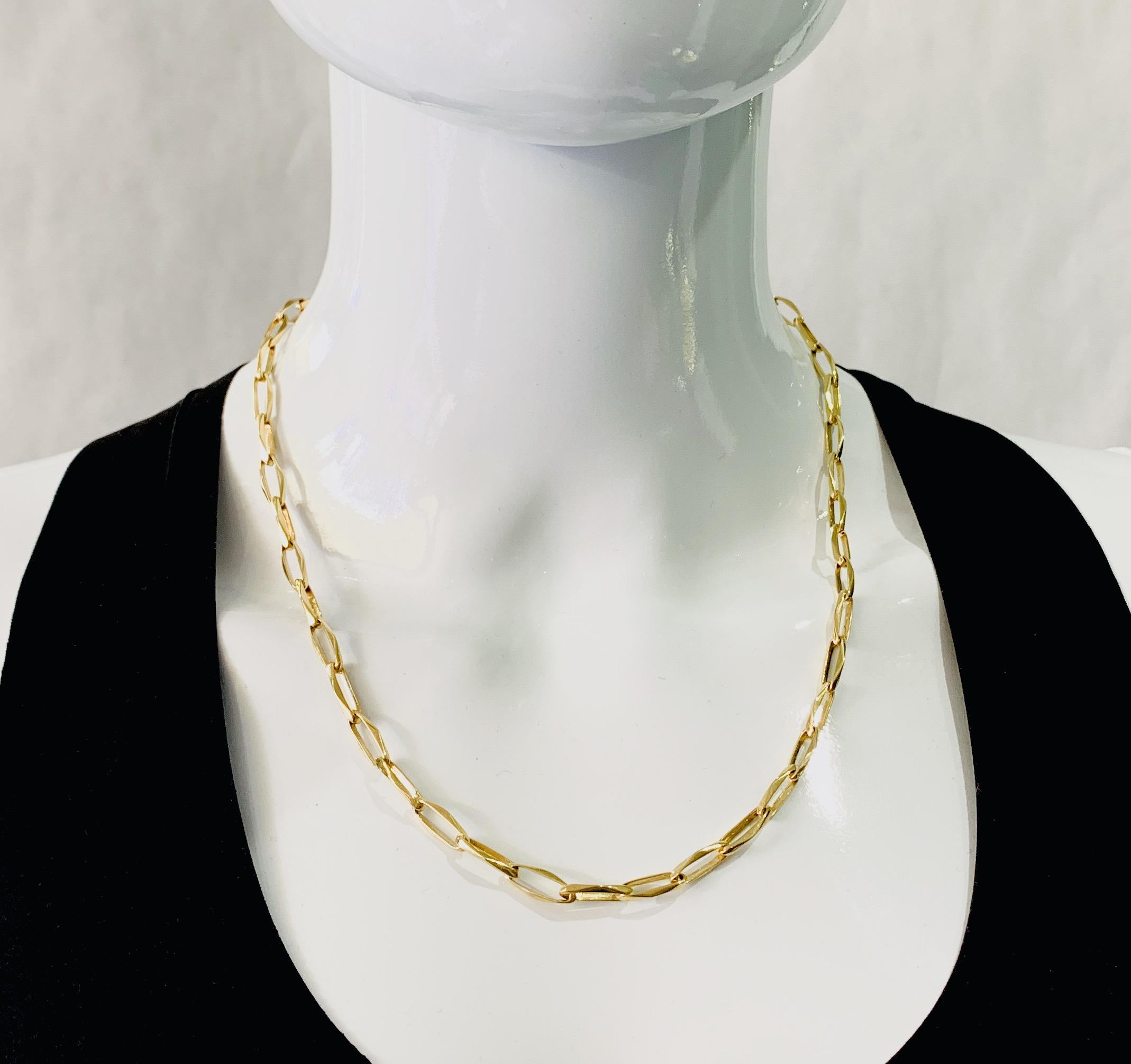 This unusual chain features long links with full, angled sides.  Subtle but beautiful,  and great for layering with other chains or worn on its own.  

Length:  20