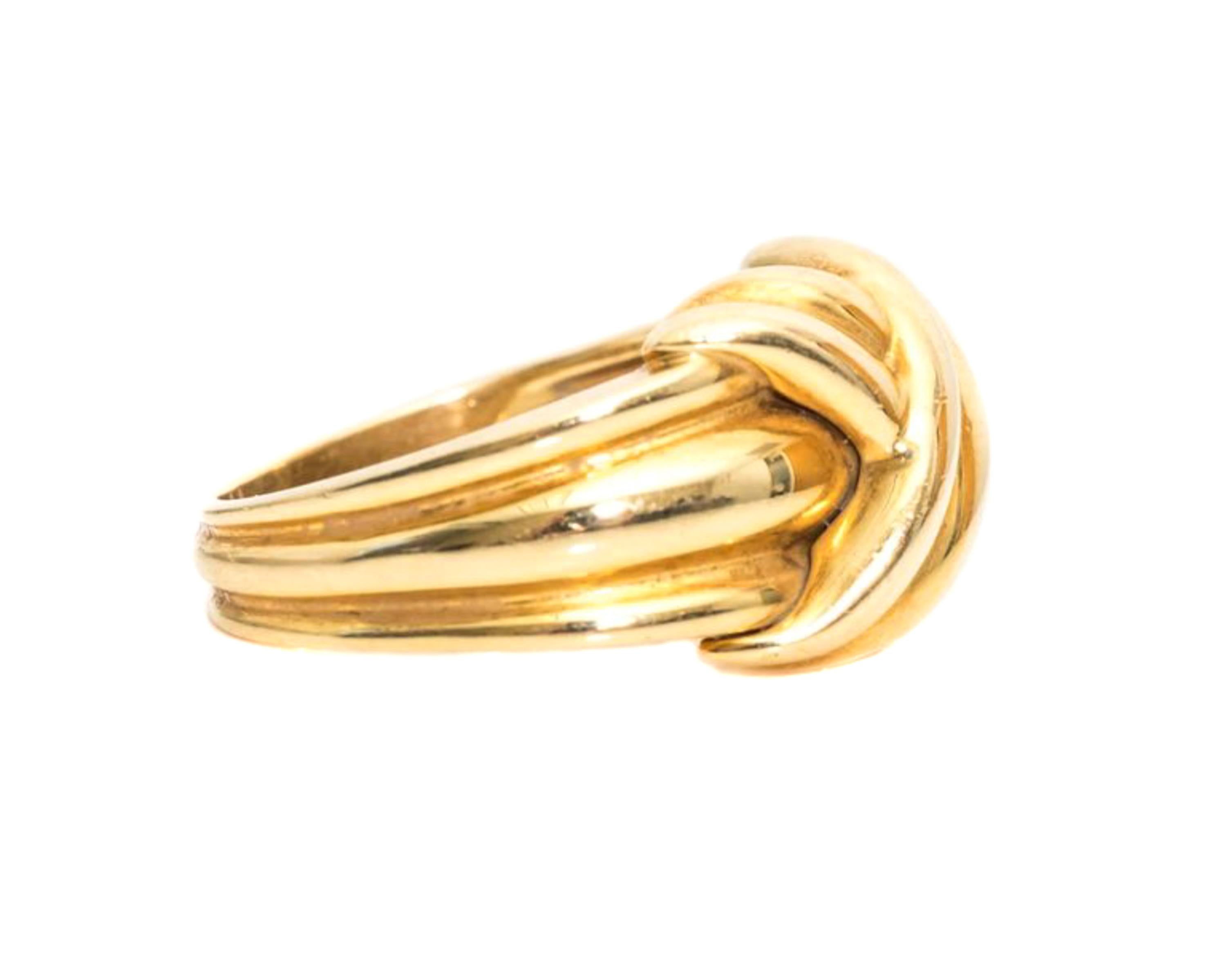 Item Description: Retired 1990s Tiffany and Co. Knot Ring crafted in 18 Karat Yellow Gold

Features: 
an X shaped knot at the center front
3 distinct bands on the shank tapering toward the center back

Ring width tapers from 12 - 4