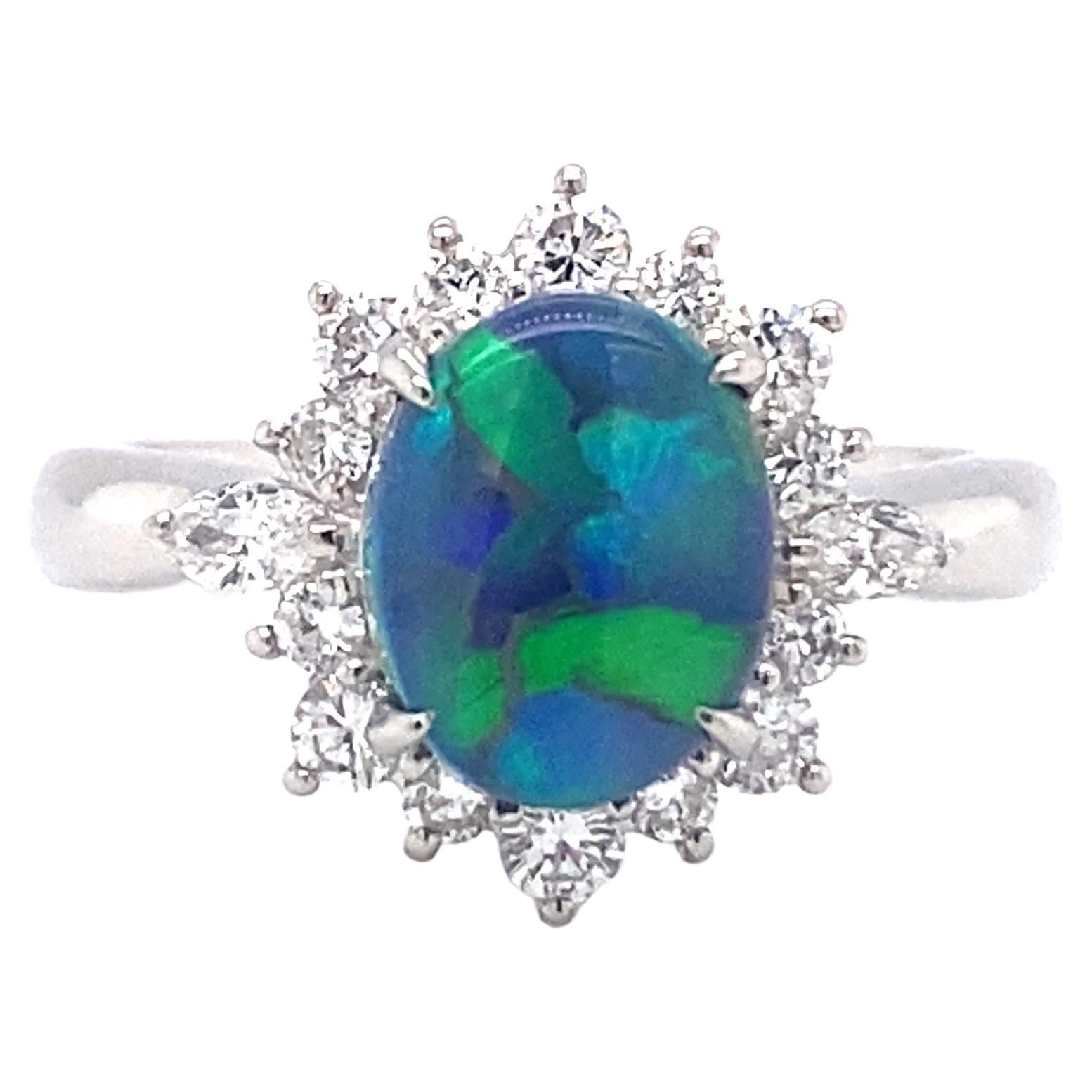 Circa 1990s 0.93 Carat Australian Black Opal and Diamond Ring in Platinum For Sale