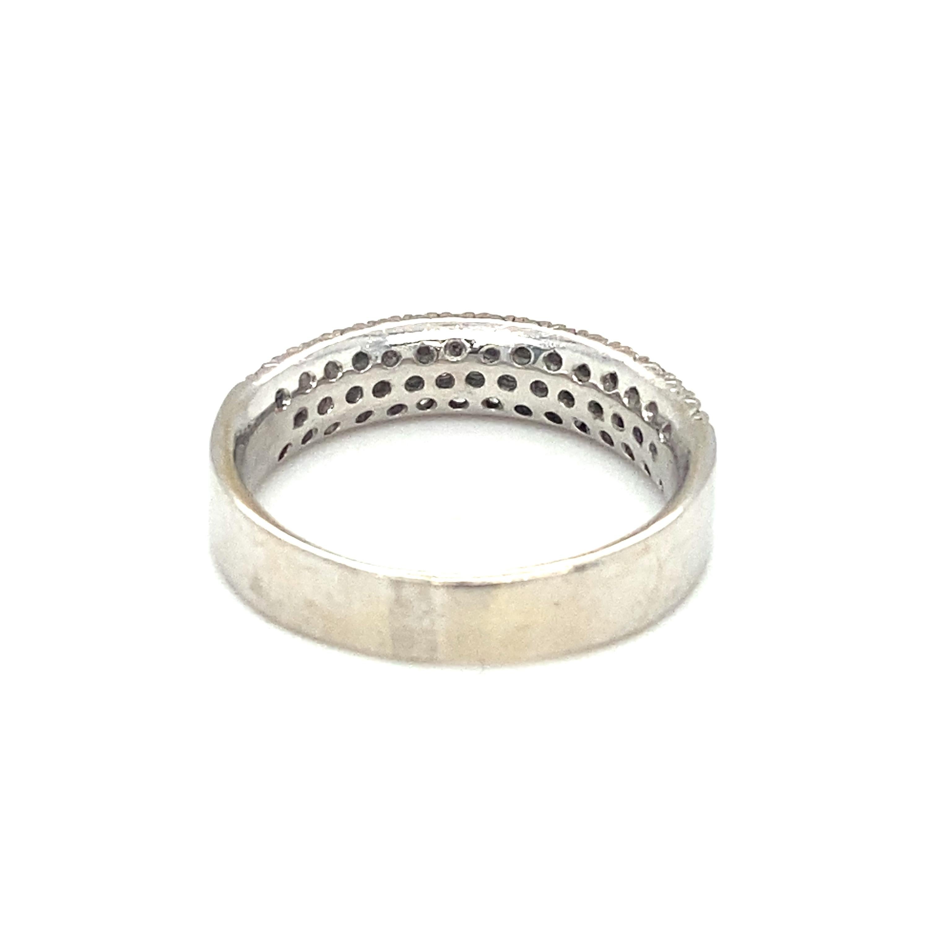 Item Details: This three row band can be worn stacked with other bands or alone as a wedding ring.

Circa: 1990s
Metal Type: 18k white gold
Weight: 5.1g
Size: US 7.75, slightly resizable

Diamond Details:
Carat: 1.0 carat total weight
Cut: