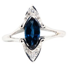 Circa 1990s 14 Carat White Gold Deep Blue Sapphire and Diamond Split Shank Ring