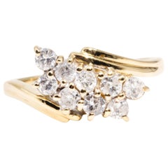 Circa 1990s, 18 Carat Yellow Gold Vintage 0.45 Carat Diamond Cluster Ring