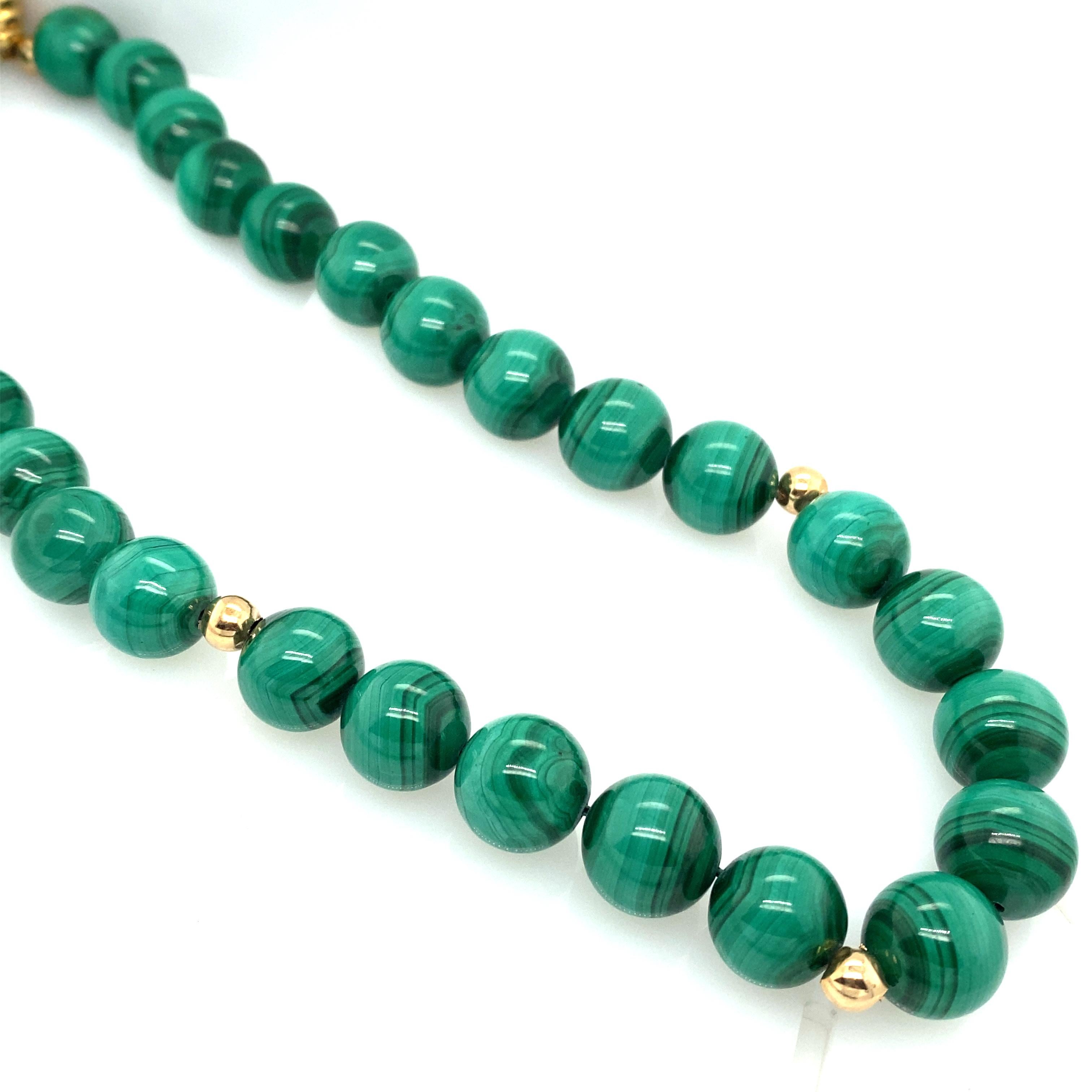 Item Details: This necklace has vibrant green malachite beads with gold bead spacers and a pearl clasp of 14 karat yellow gold. It is wonderful as a pop of color or a statement piece!

Circa: 1990s
Metal Type: 14 Karat Yellow Gold
Weight: 148.9